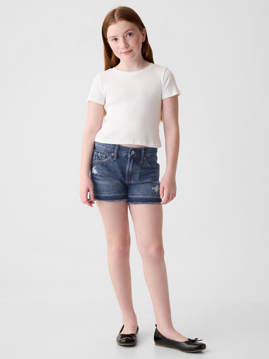 Shorts in denim con abrasioni a vita bassa_0