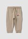 Pantaloni jogger beige in puro cotone con stampa cagnolino per bimbo_0