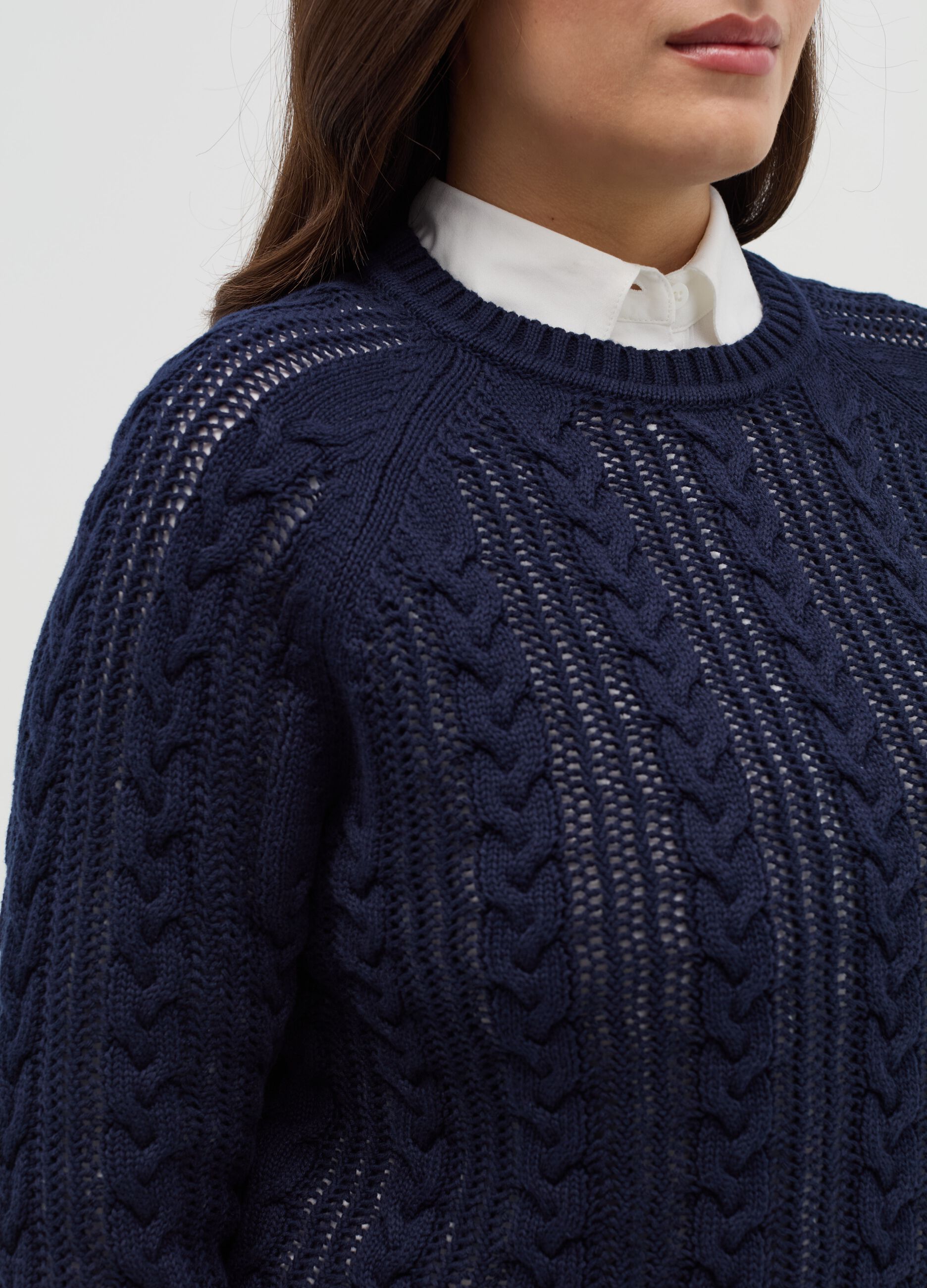 Curvy crochet pullover with cable-knit design