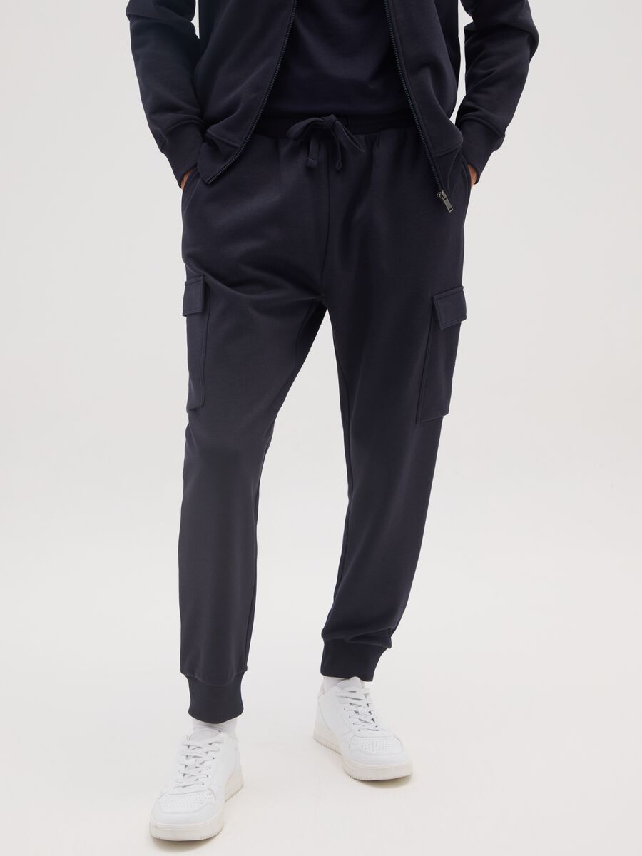 Blue cotton blend trousers with cargo pockets_1