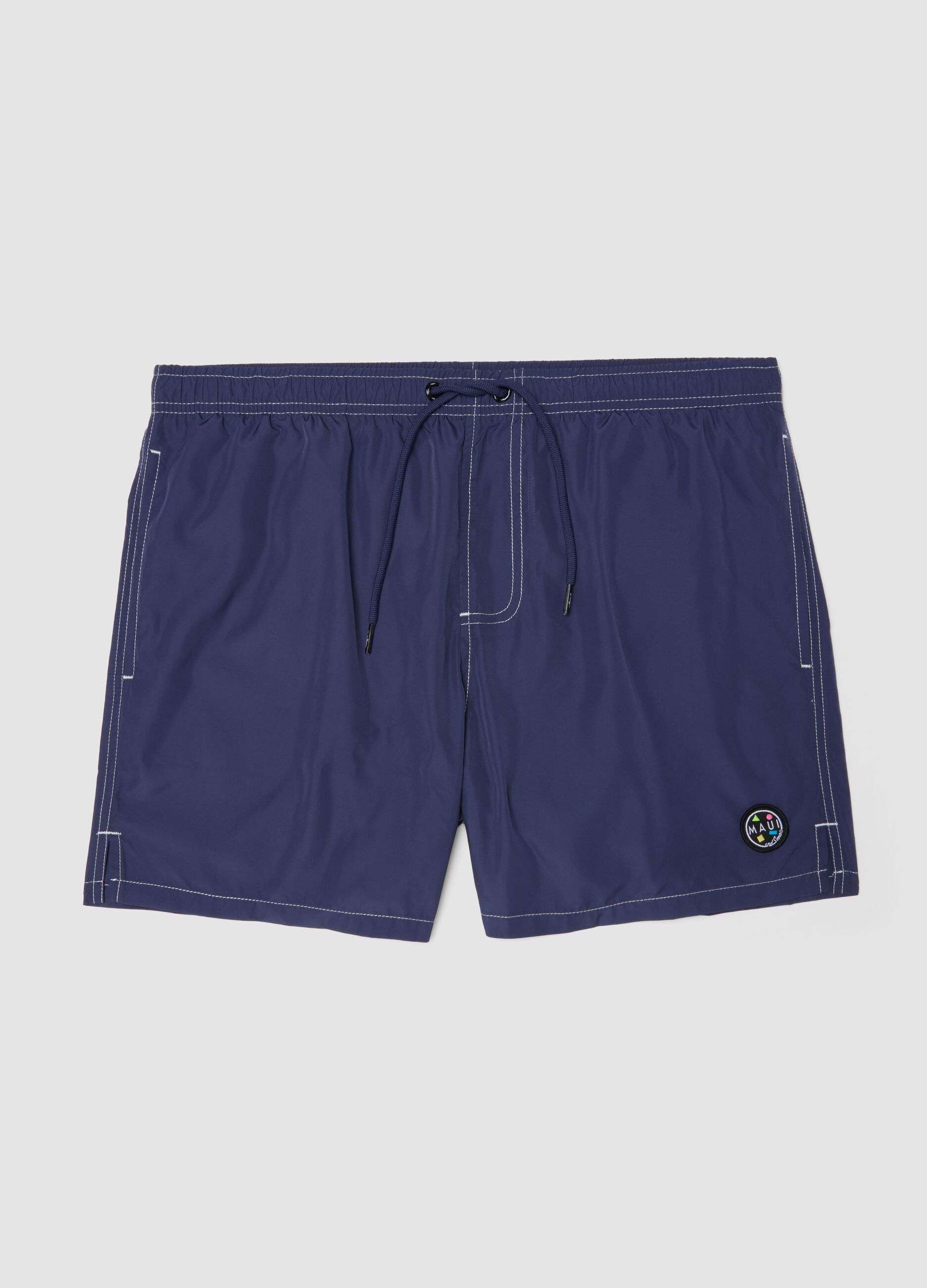 Blue swim shorts with drawstring waist