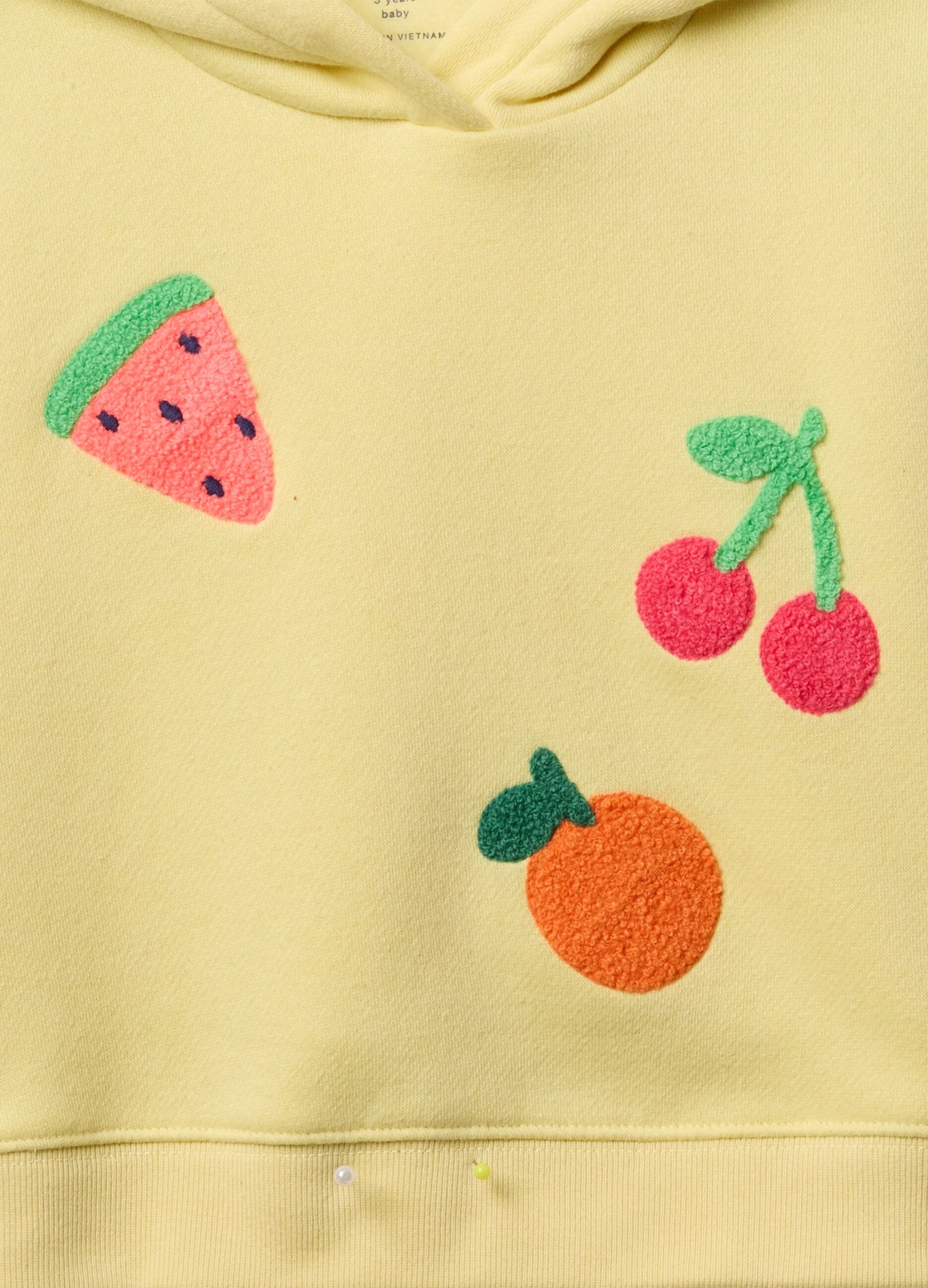 Yellow jogging set with bouclé fruit patch
