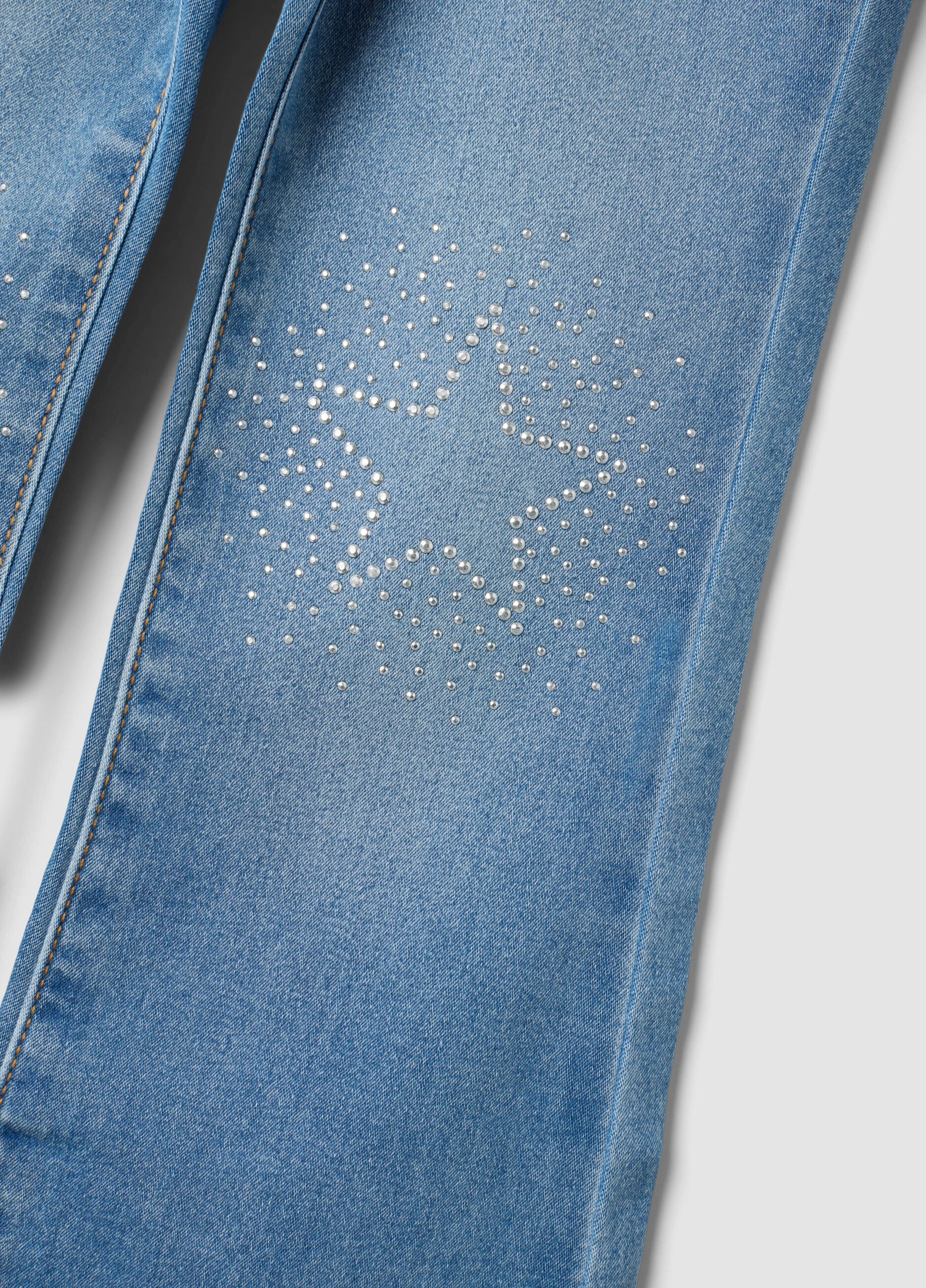 Jeggings denim in cotone elasticizzato a zampa con strass per bambina