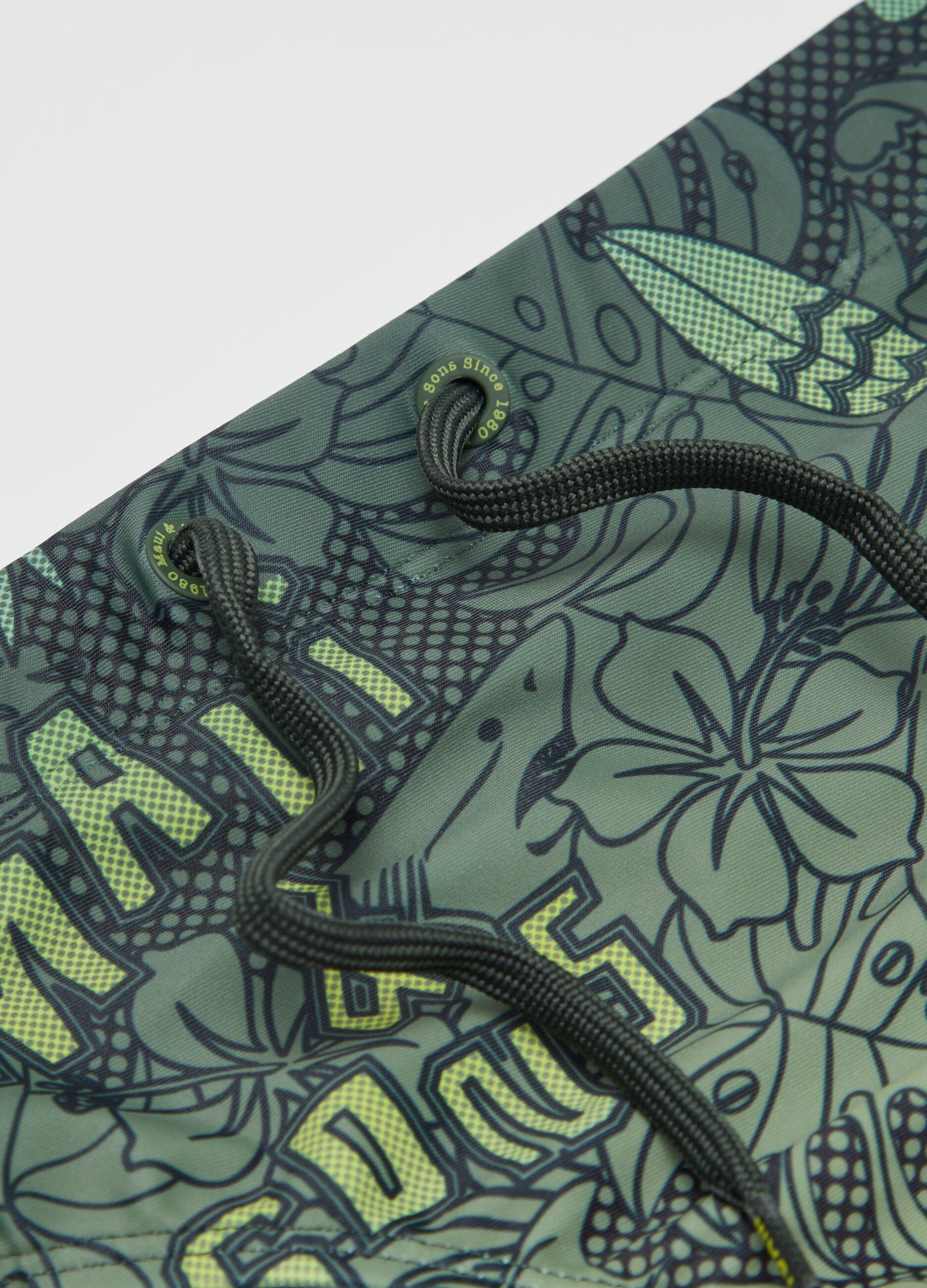 Swim briefs with foliage print