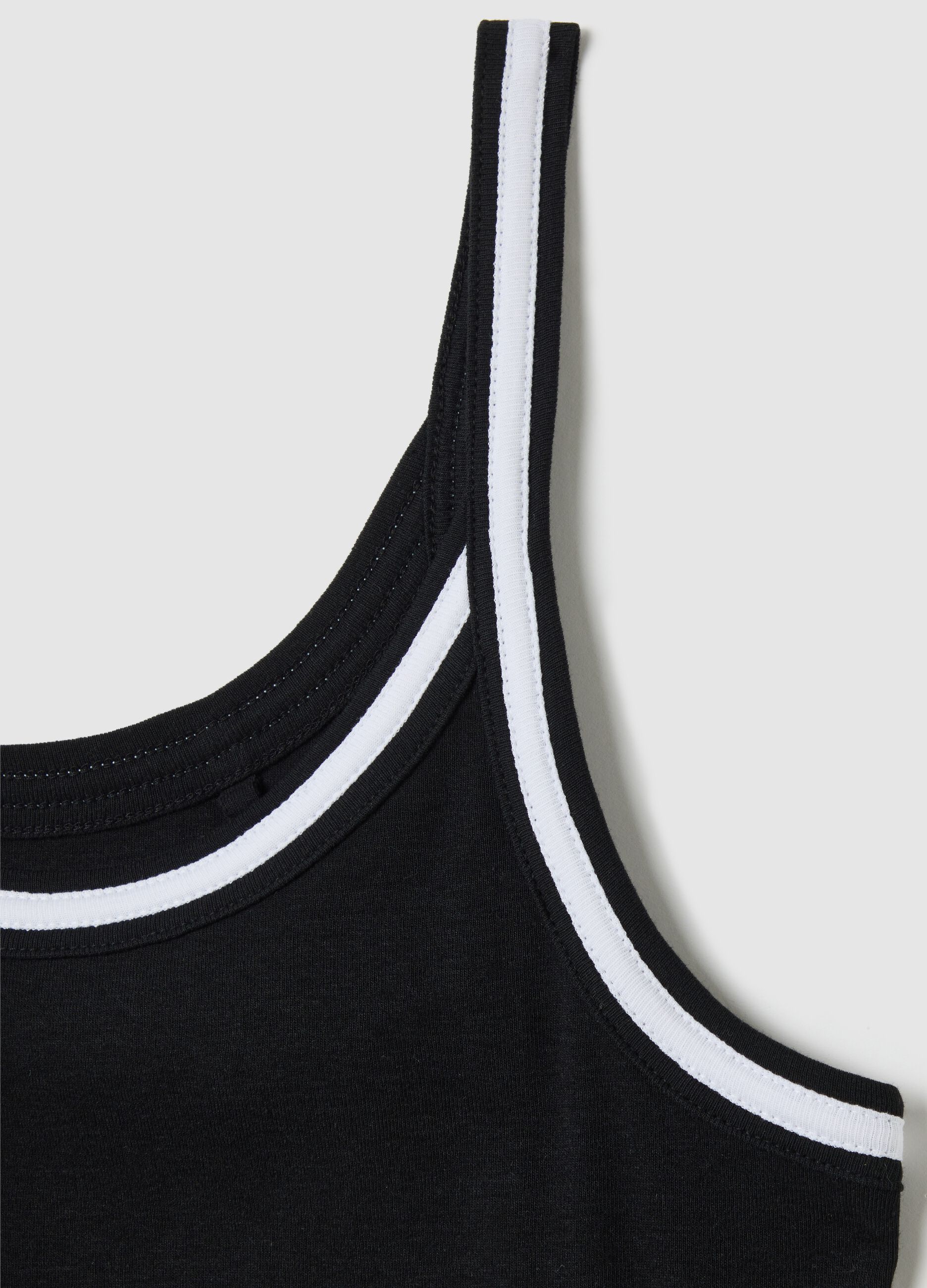 Black cotton vest with white trim
