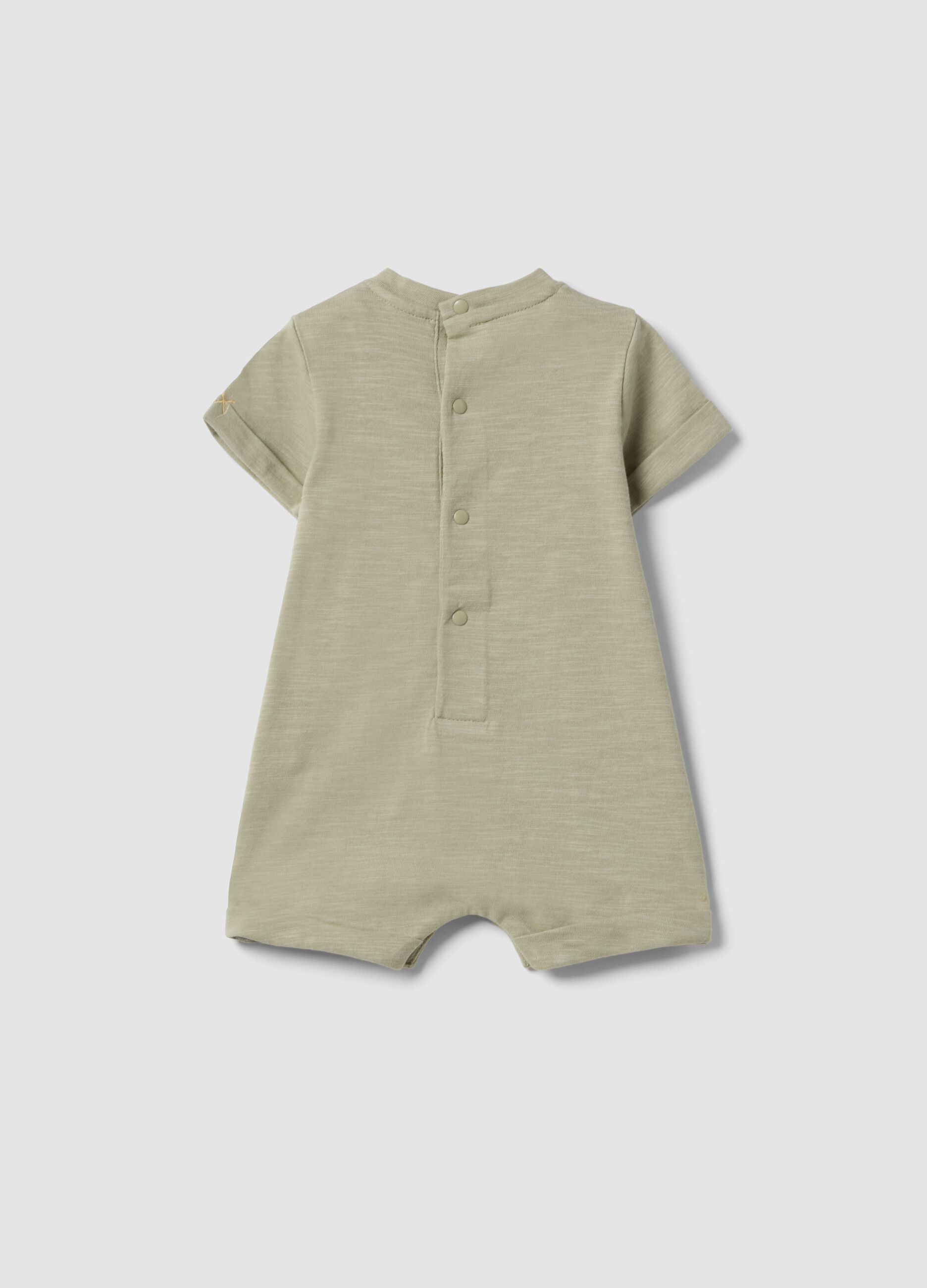 Green organic cotton baby romper with animal print