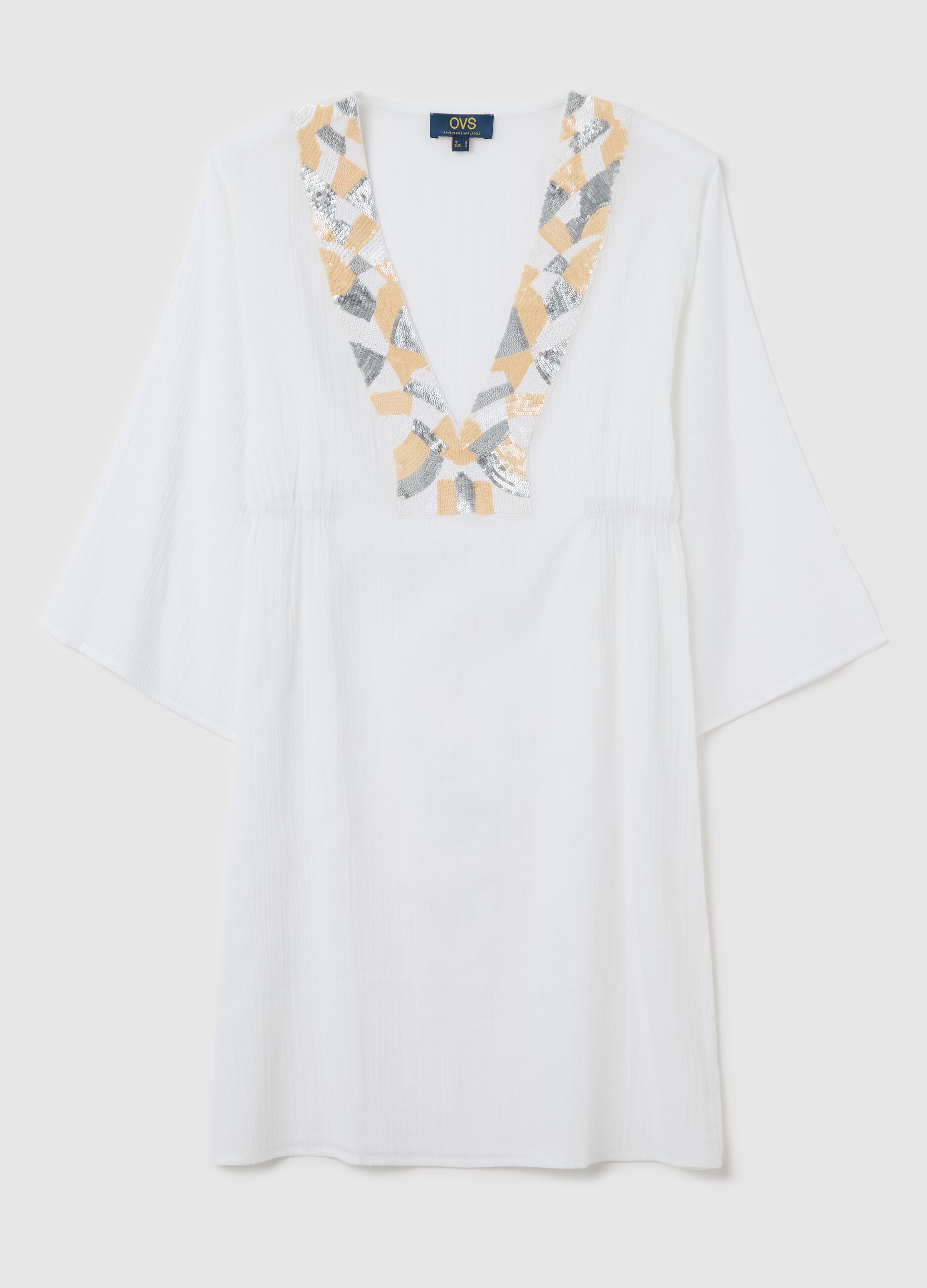 White beach cover-up with decorative edging