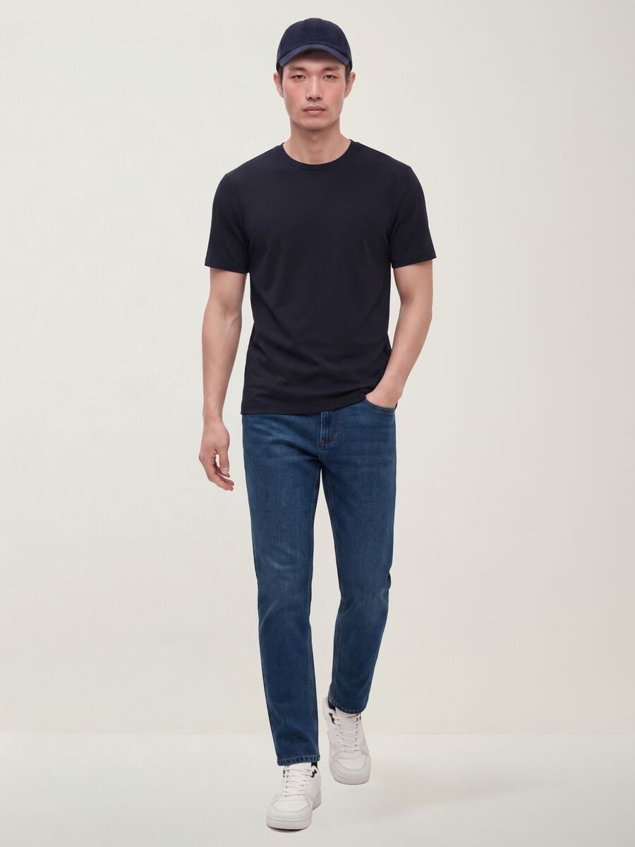 Jeans blu denim in misto cotone e viscosa slim fit_0