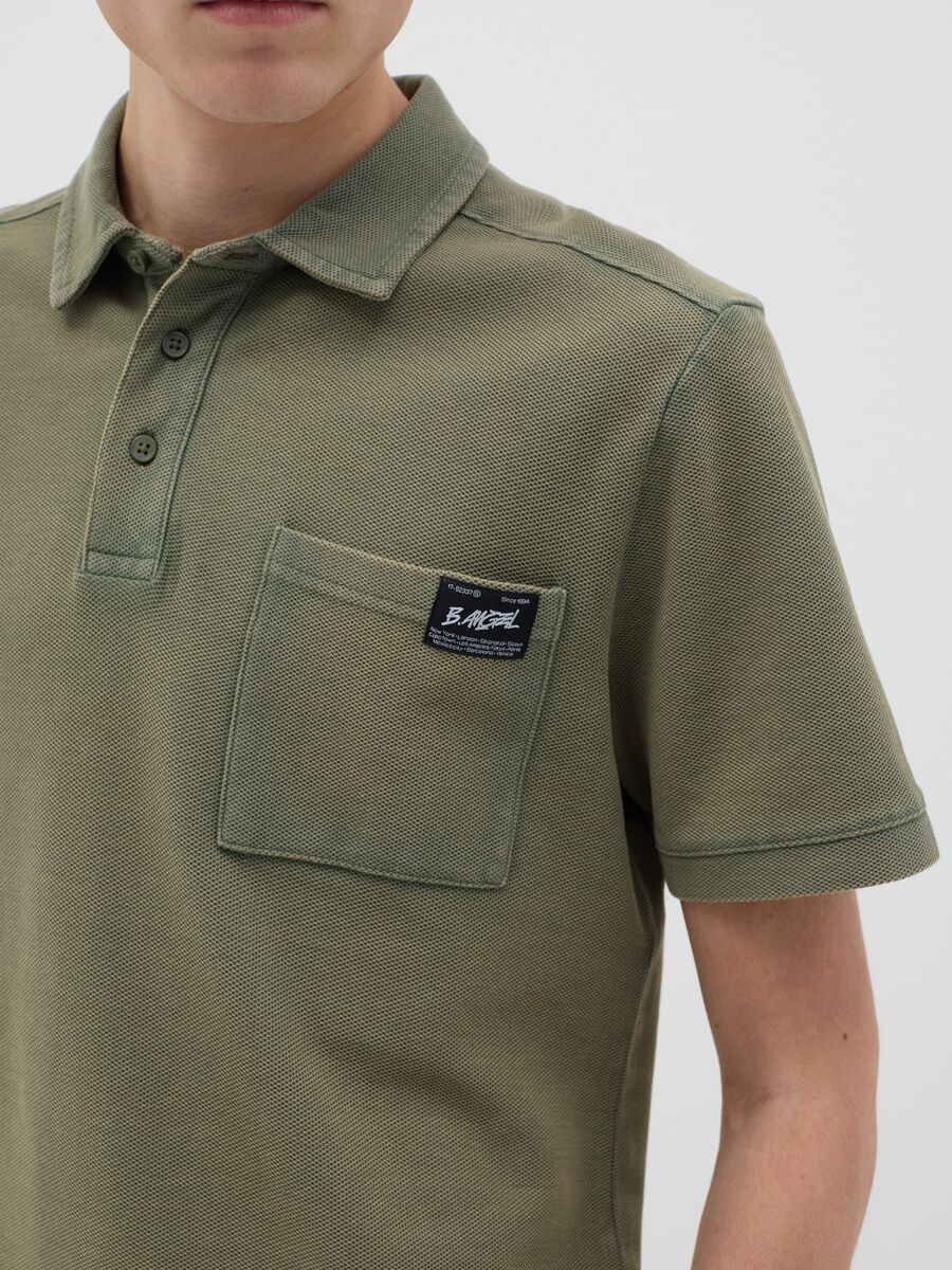 Green short-sleeved polo shirt in cotton piquet_3