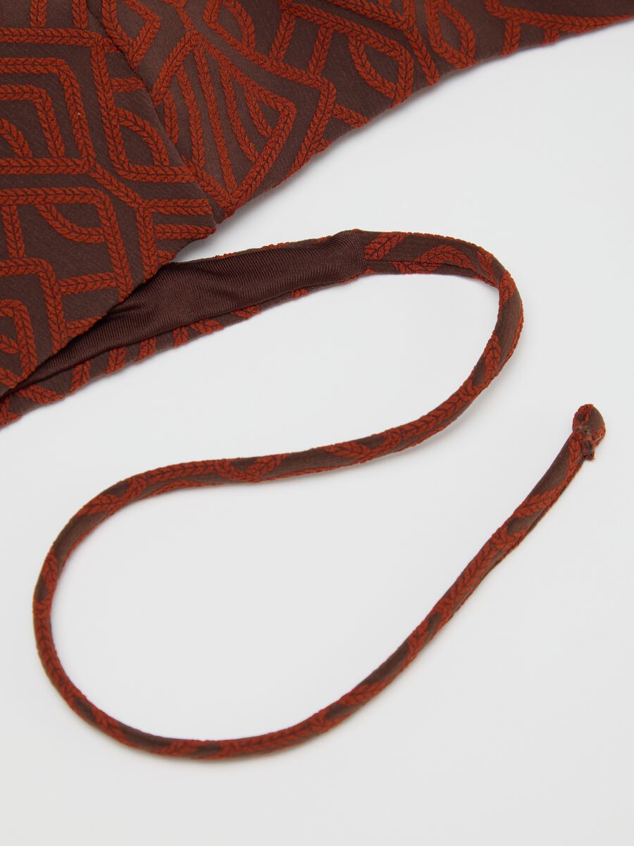 Women’s bikini in brown stretch fabric with geometric texture._1