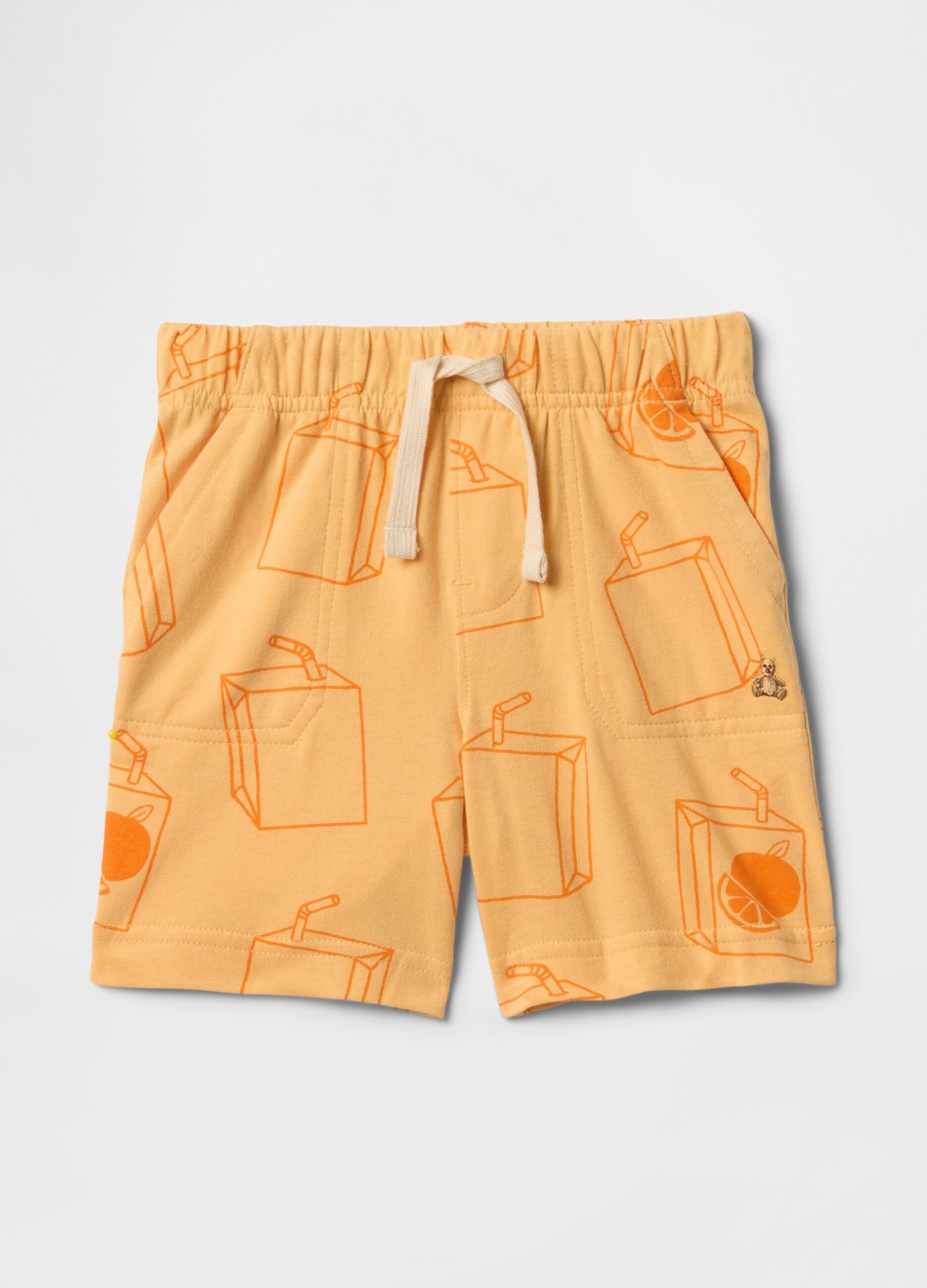 Orange shorts with fruit juice pattern