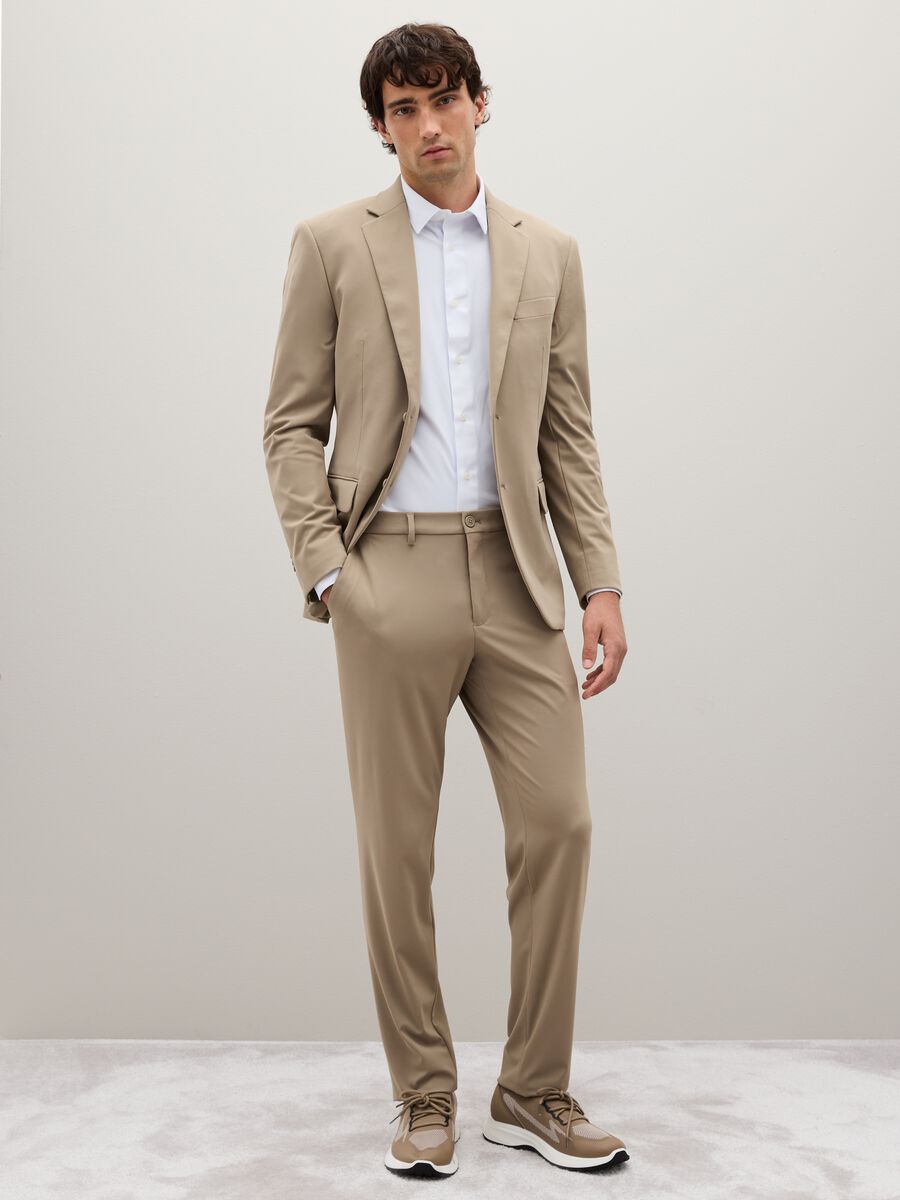 Beige slim fit trousers in stretch fabric_0