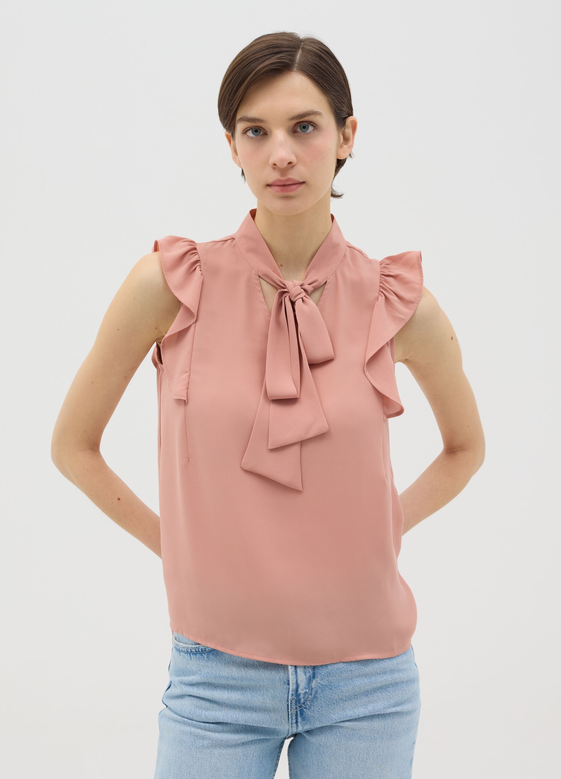 Pink sleeveless blouse with flounce
