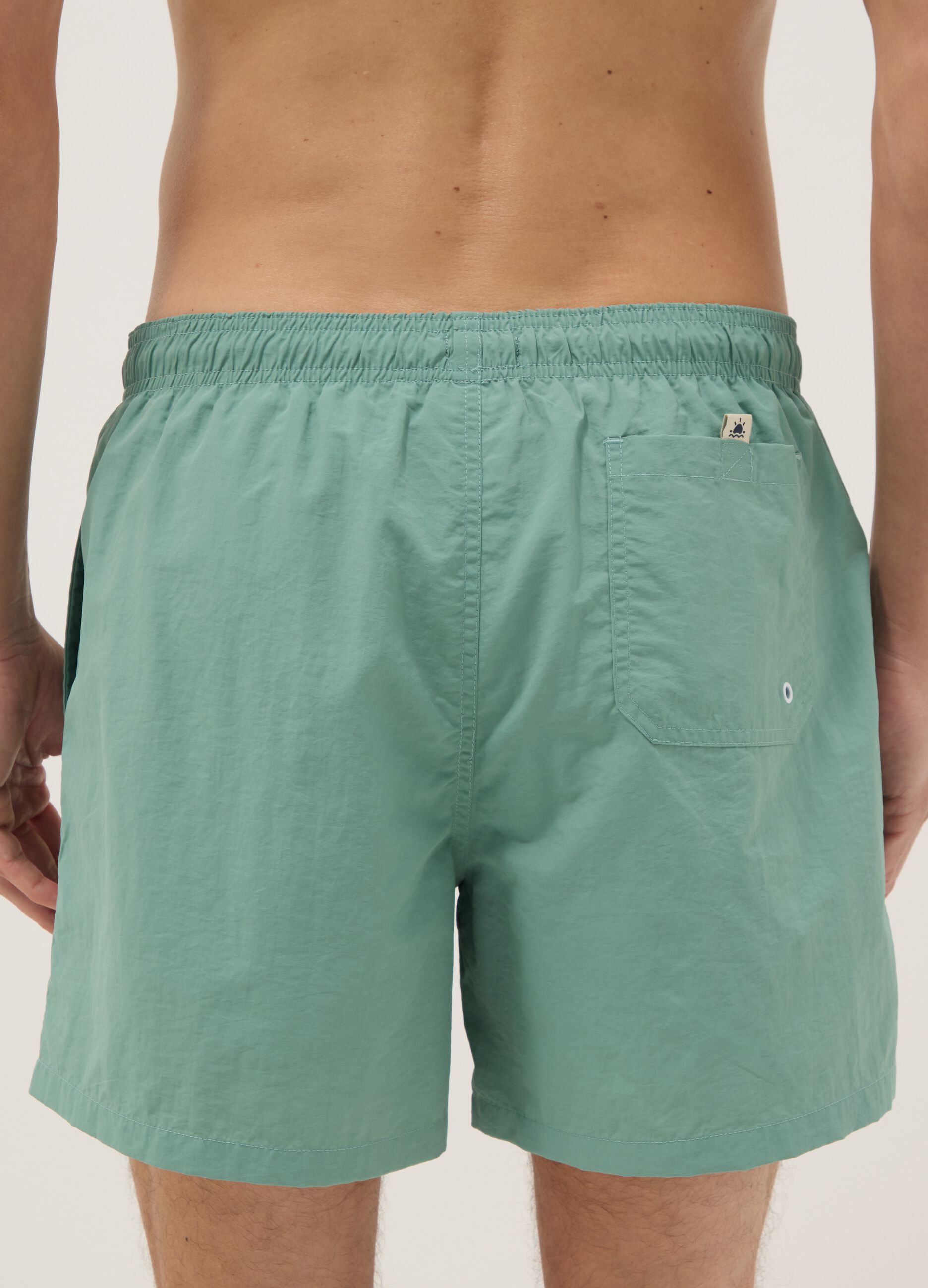 Green swim shorts with elasticated waistband