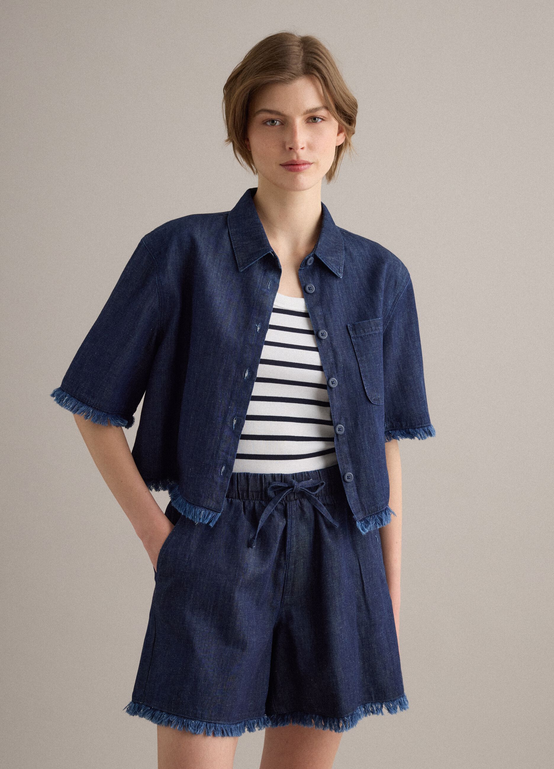 Blue denim shirt in cotton blend, oversized fit with frayed hem