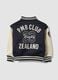 Blue varsity jacket with beige sleeves and print for boys_5