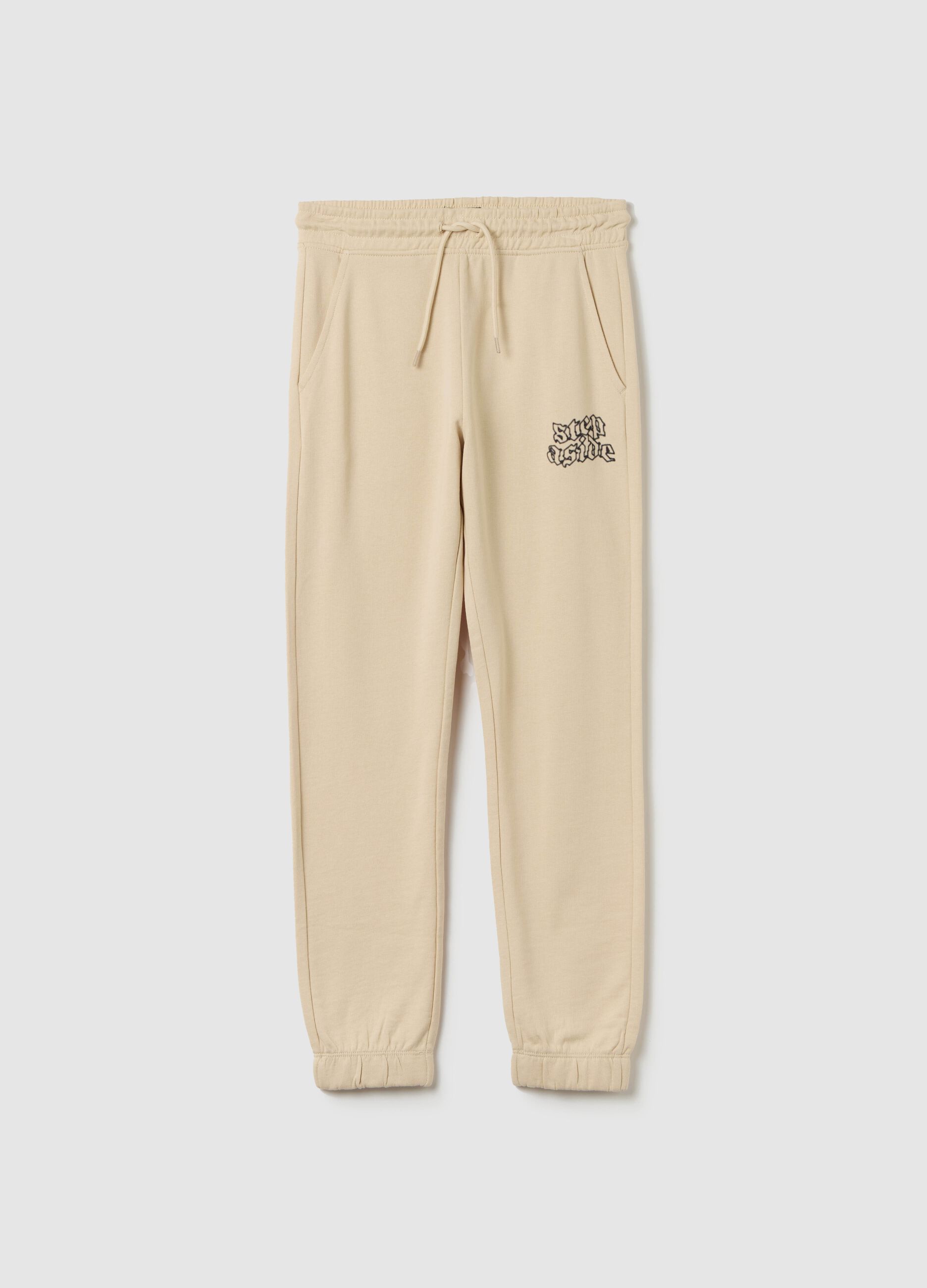Joggers with drawstring and "Step Aside" print