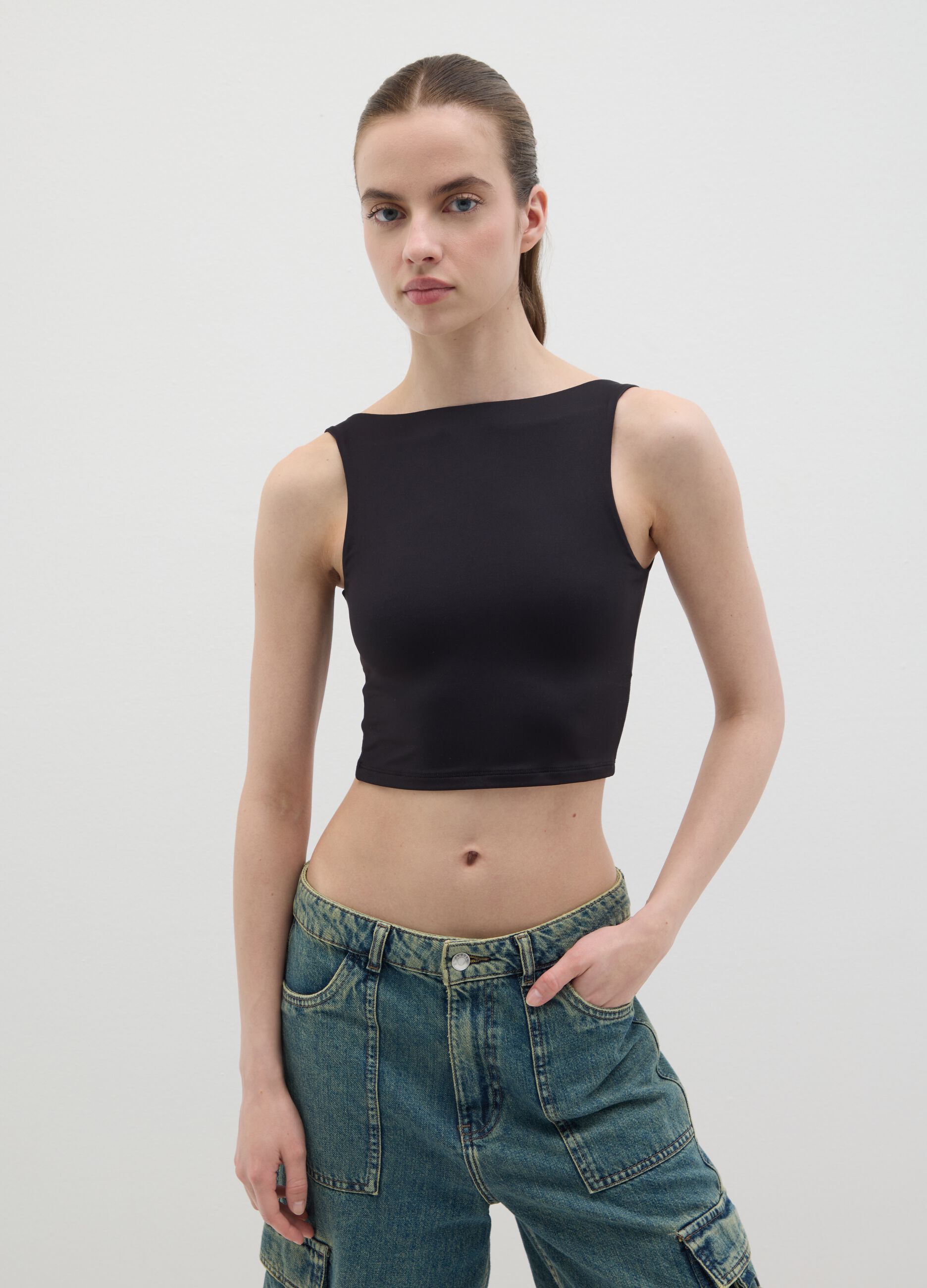 Women’s fitted top in black stretch fabric with wide straps