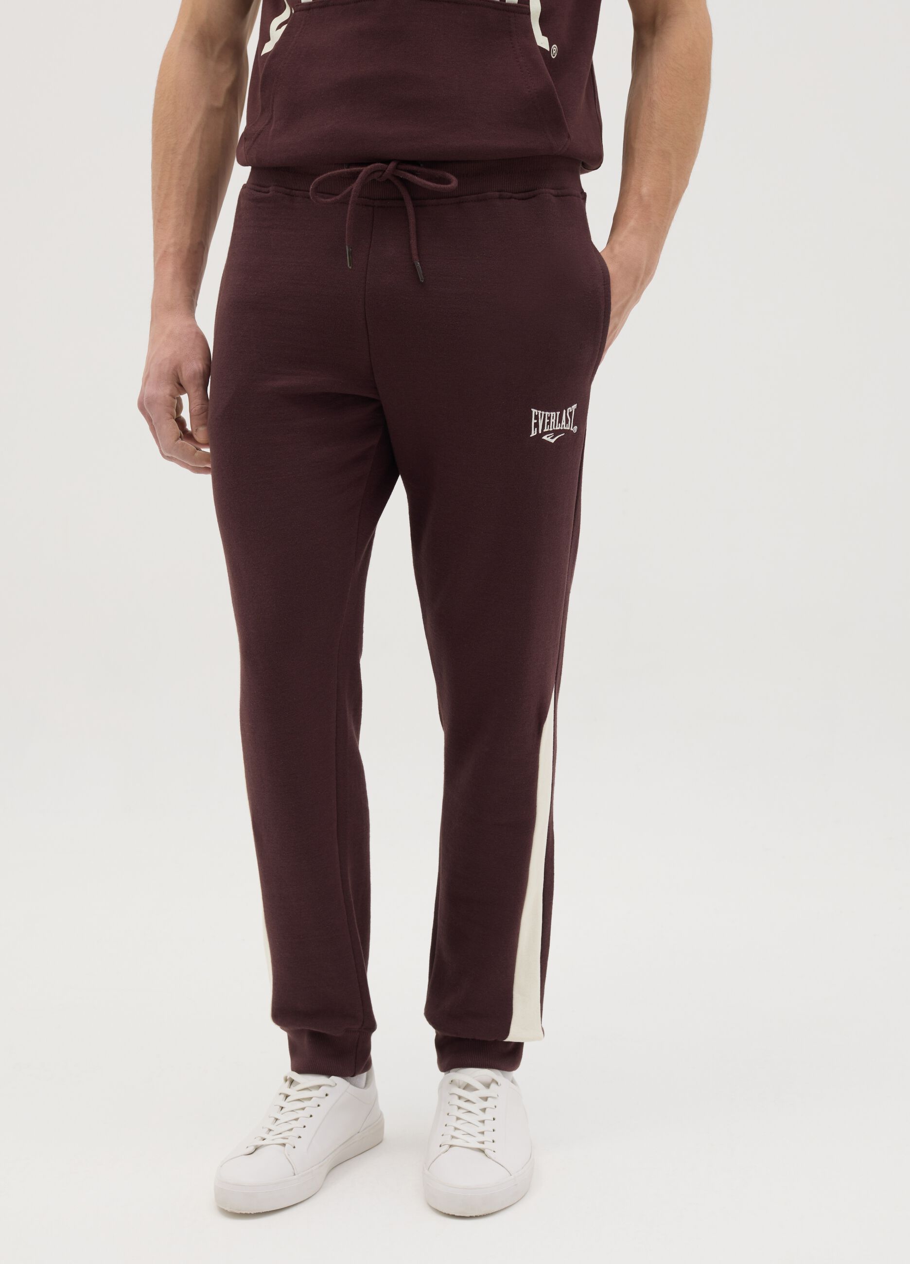 Joggers with contrasting inserts and logo embroidery