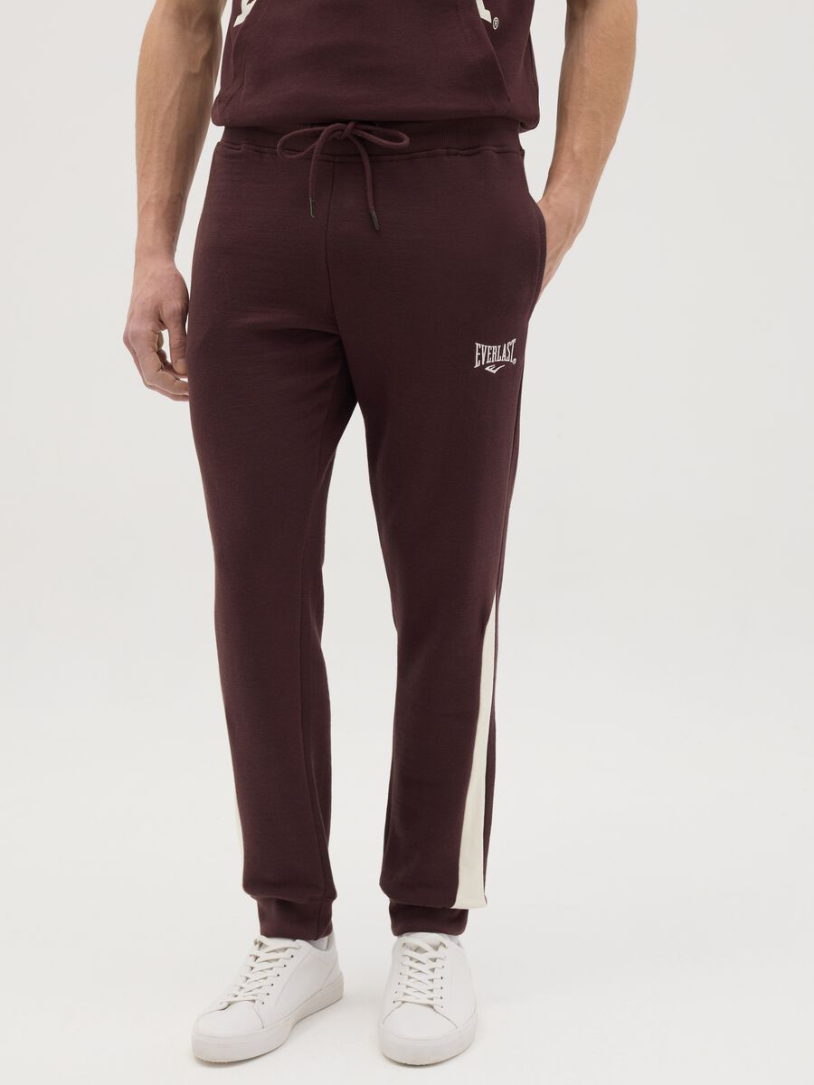 Joggers with contrasting inserts and logo embroidery_1