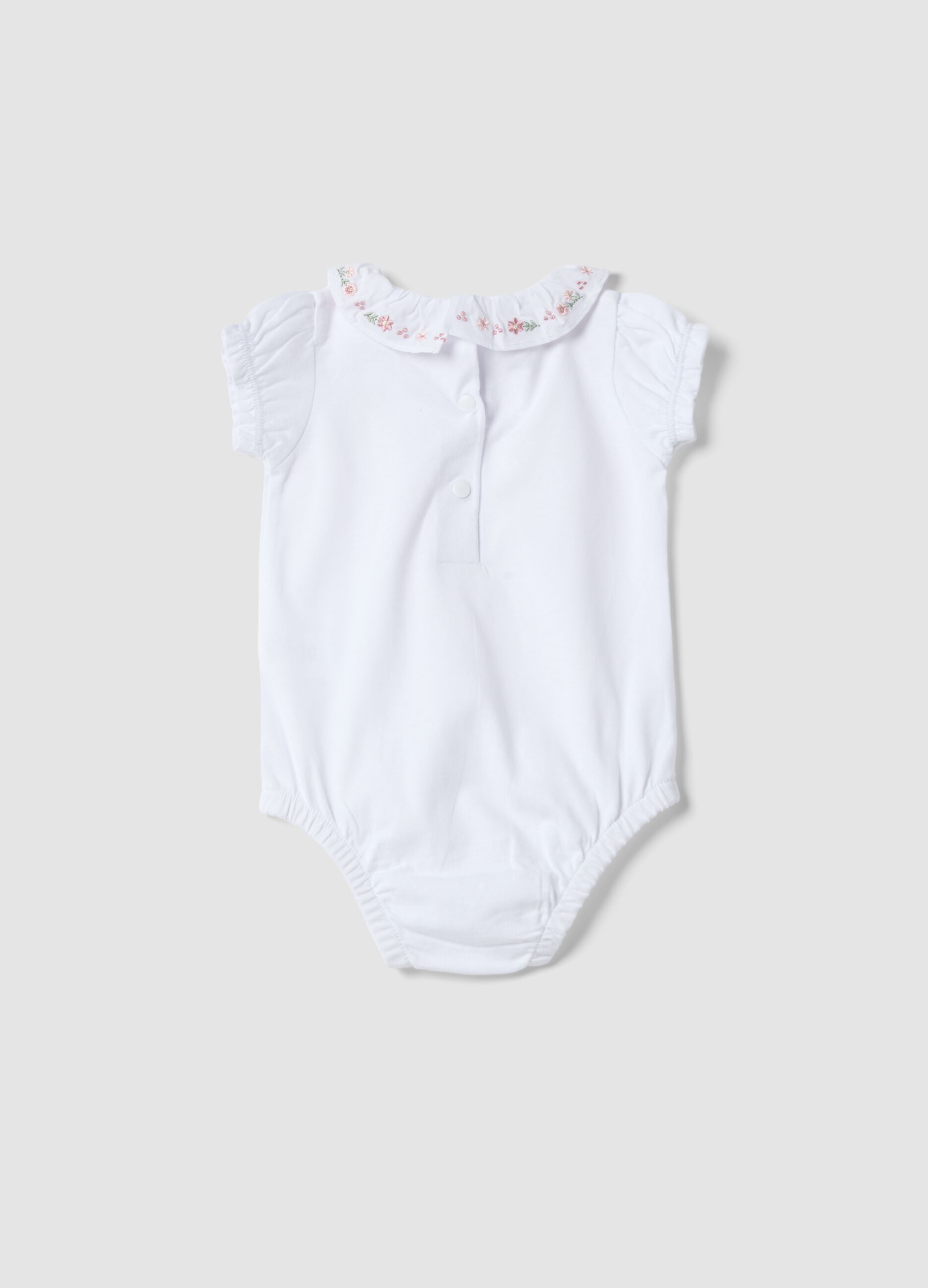 White organic cotton baby bodysuit with ruffled collar