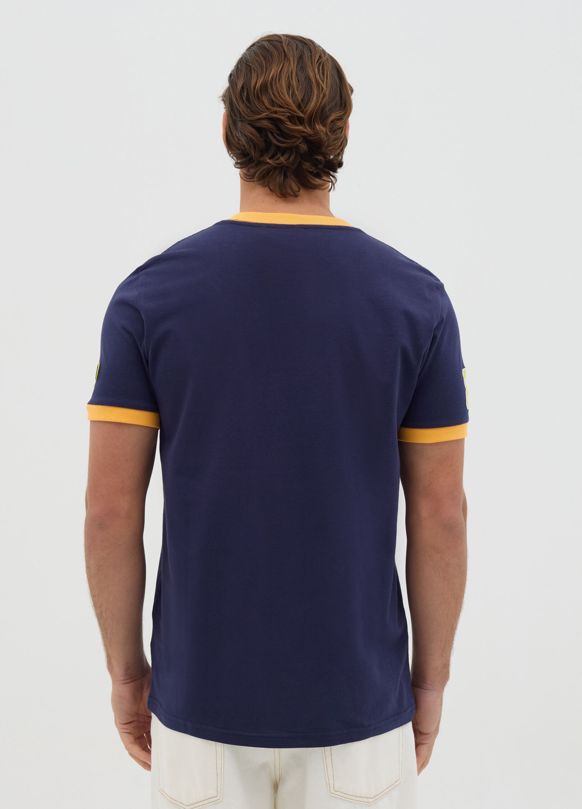 Blue T-shirt with short sleeves and orange details