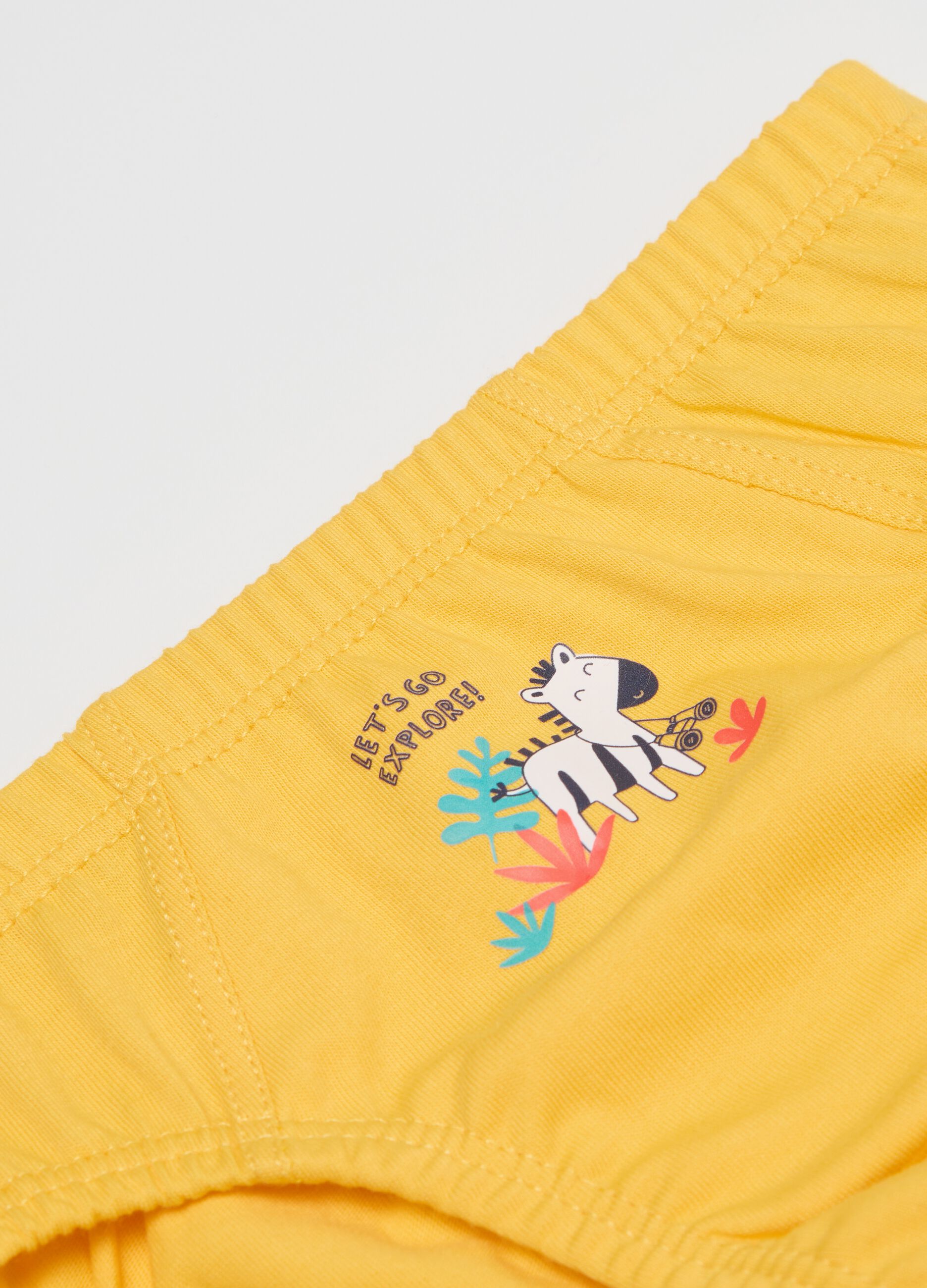Three-pack yellow and light blue organic cotton briefs with savannah animals