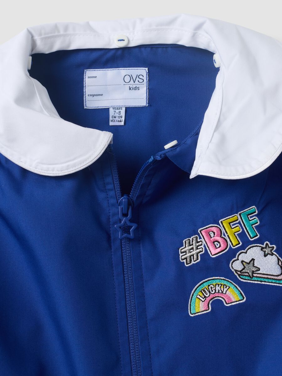 Blue girls&rsquo; school apron with rainbow embroidery_2