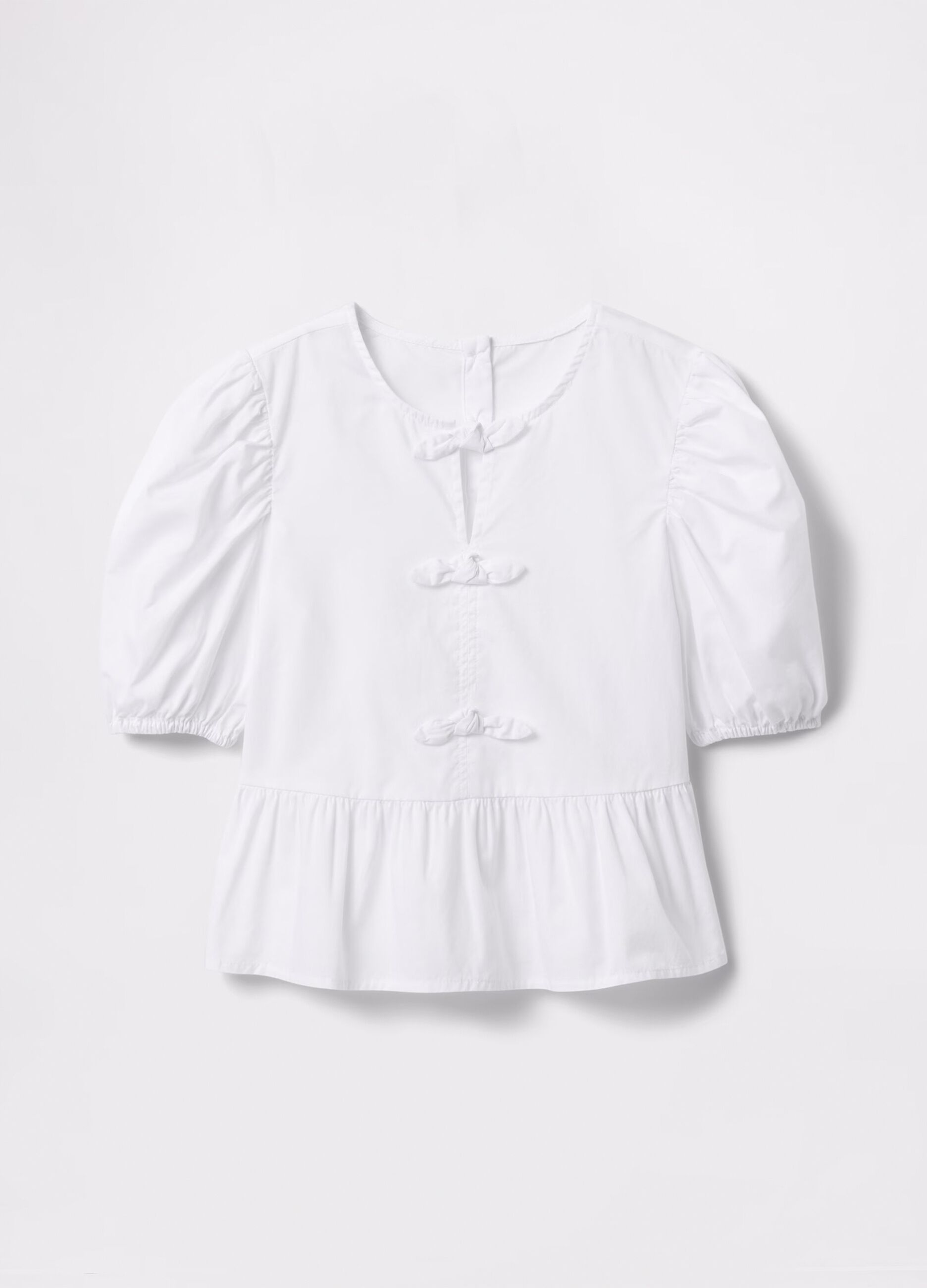 White shirt in cotton with bows