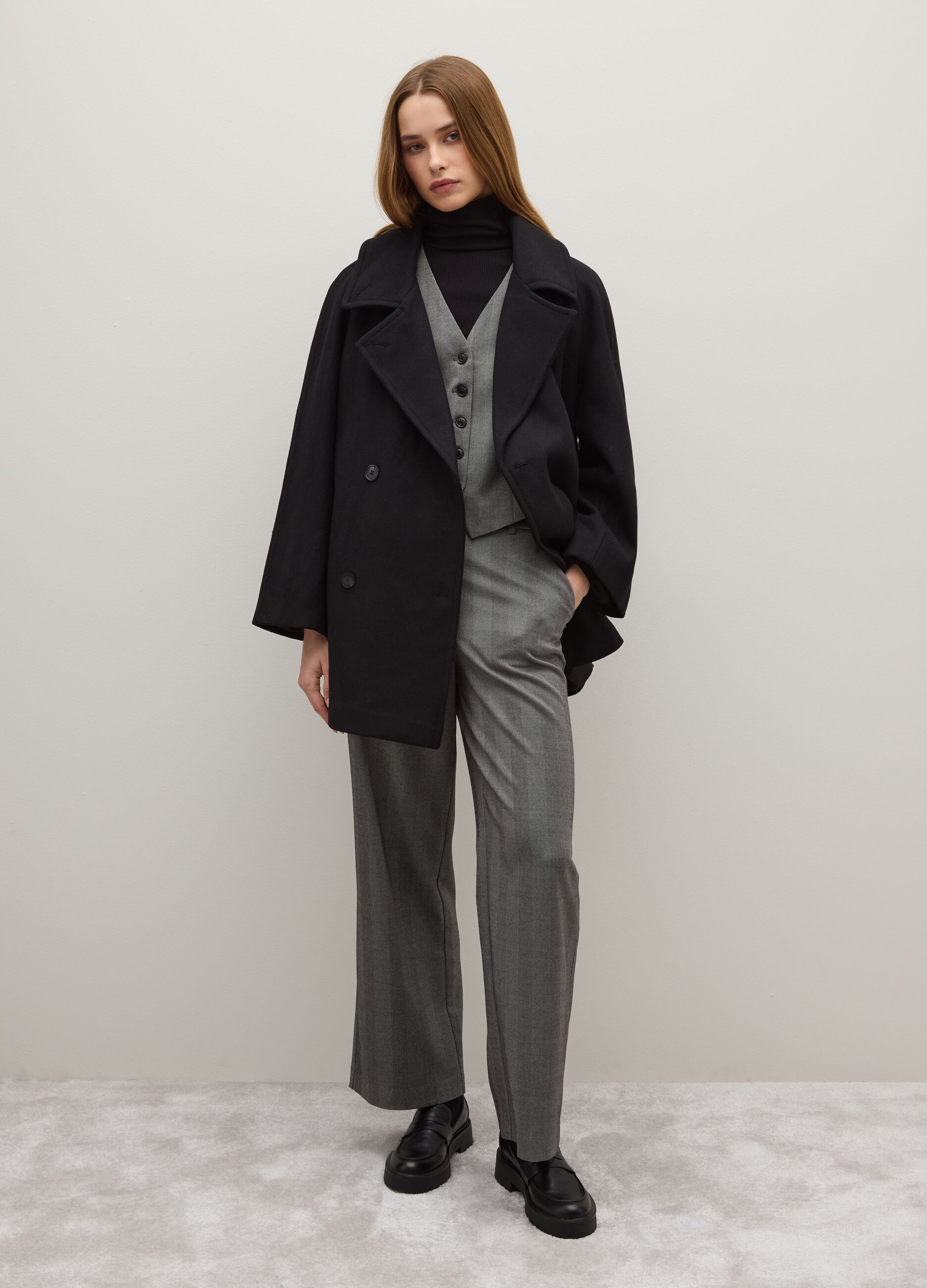 Oversized black coat with buttons