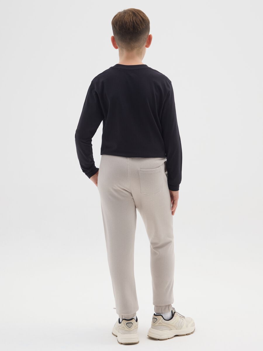 Jogger beige da ragazzo in puro cotone regular fit con scritta_1