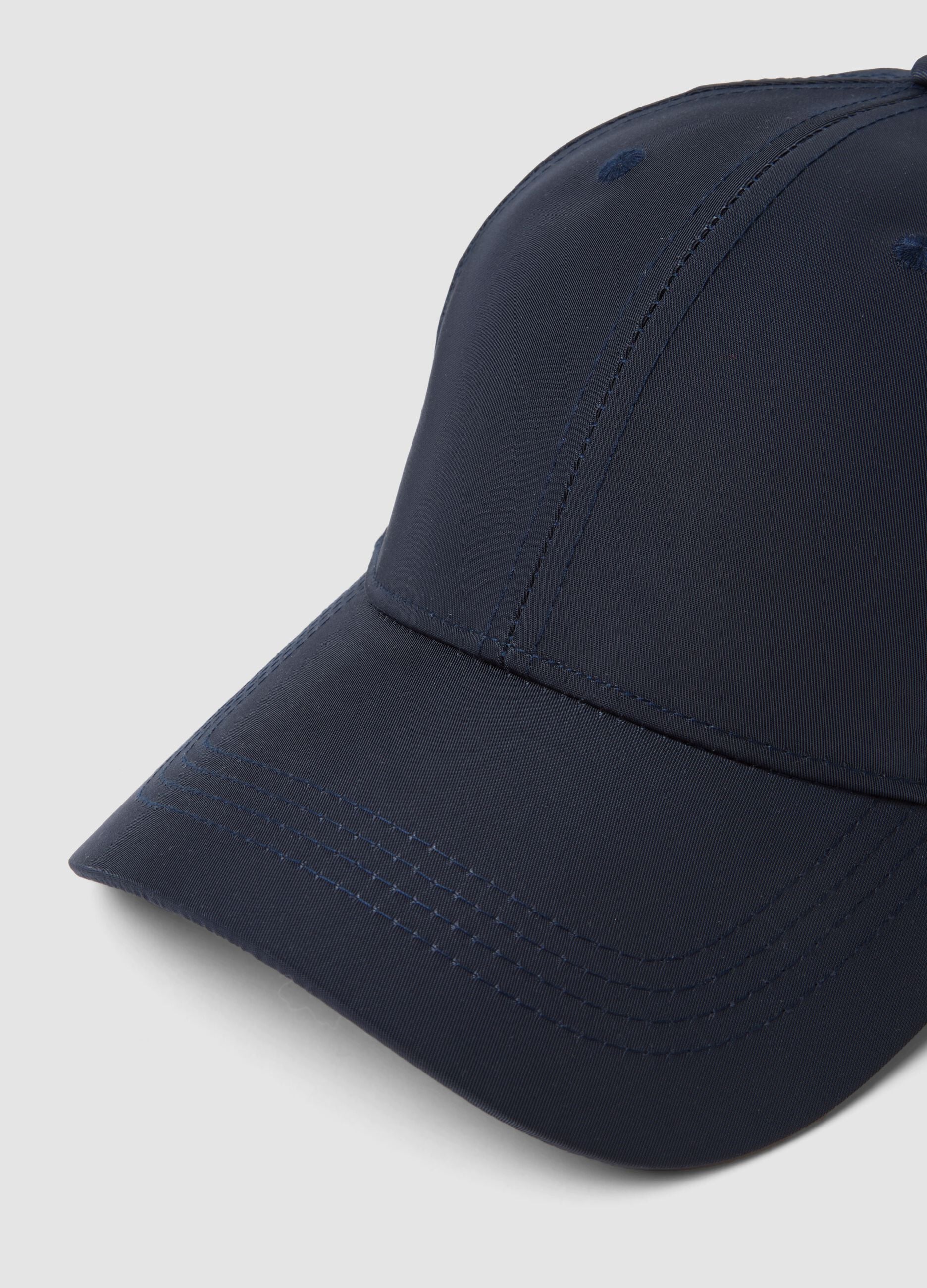 Blue cap with curved peak