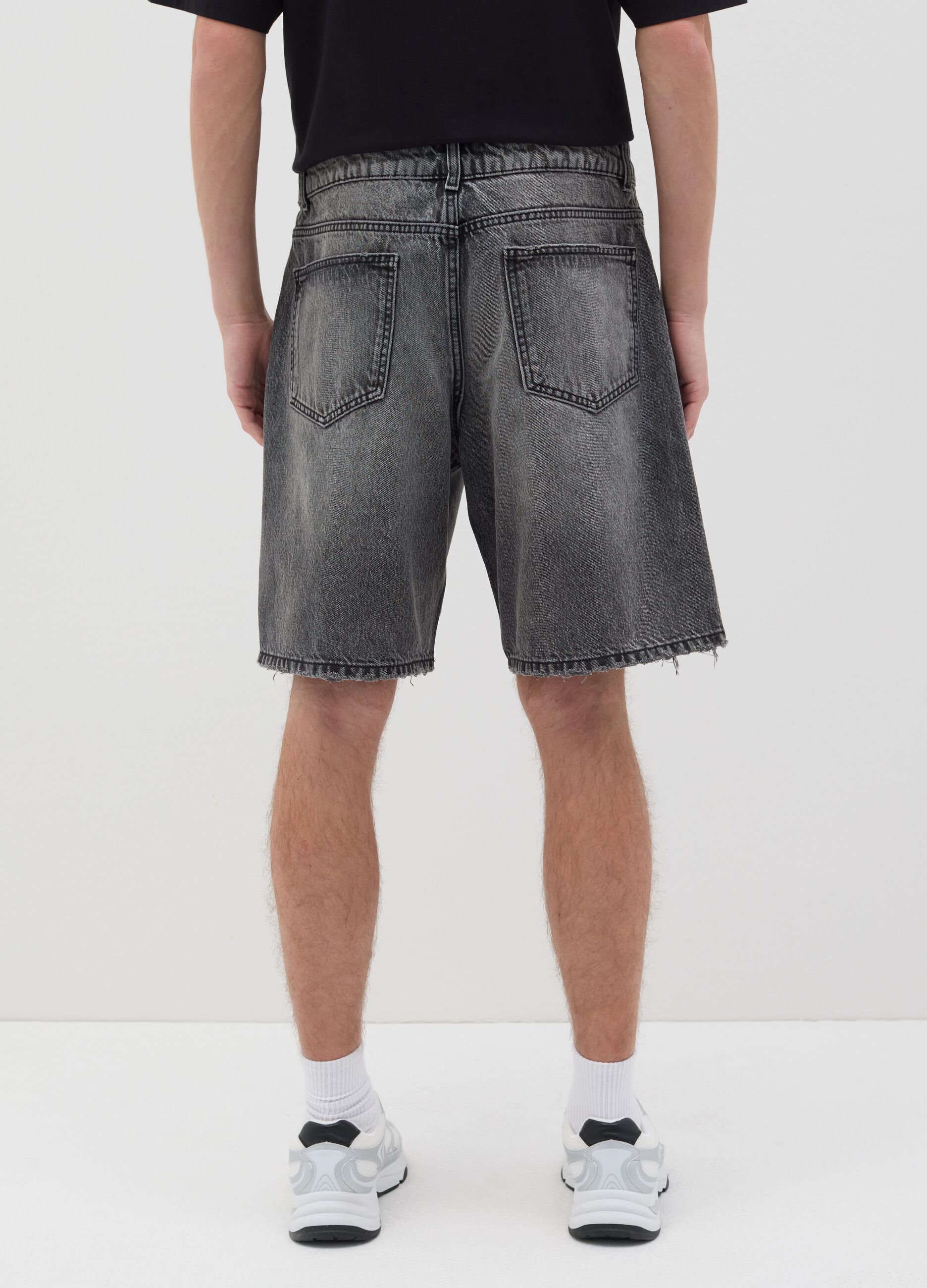 Black denim shorts with ripped details