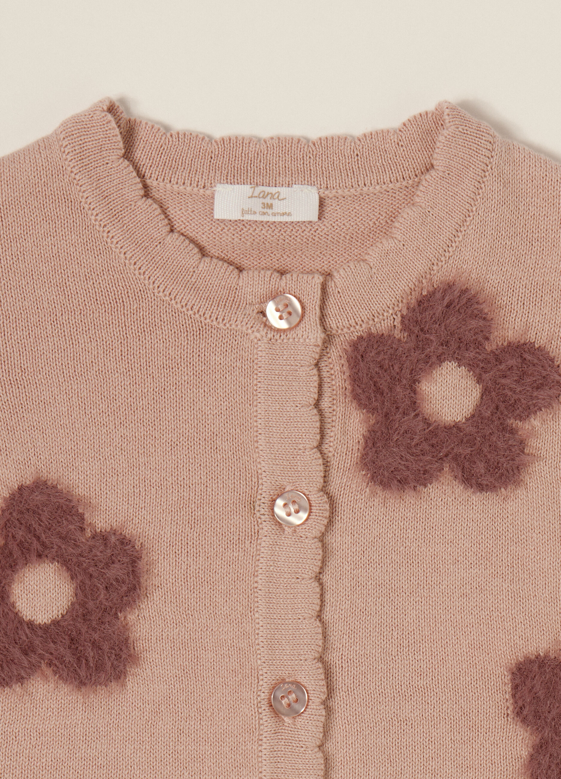 Pink cardigan with cotton flowers