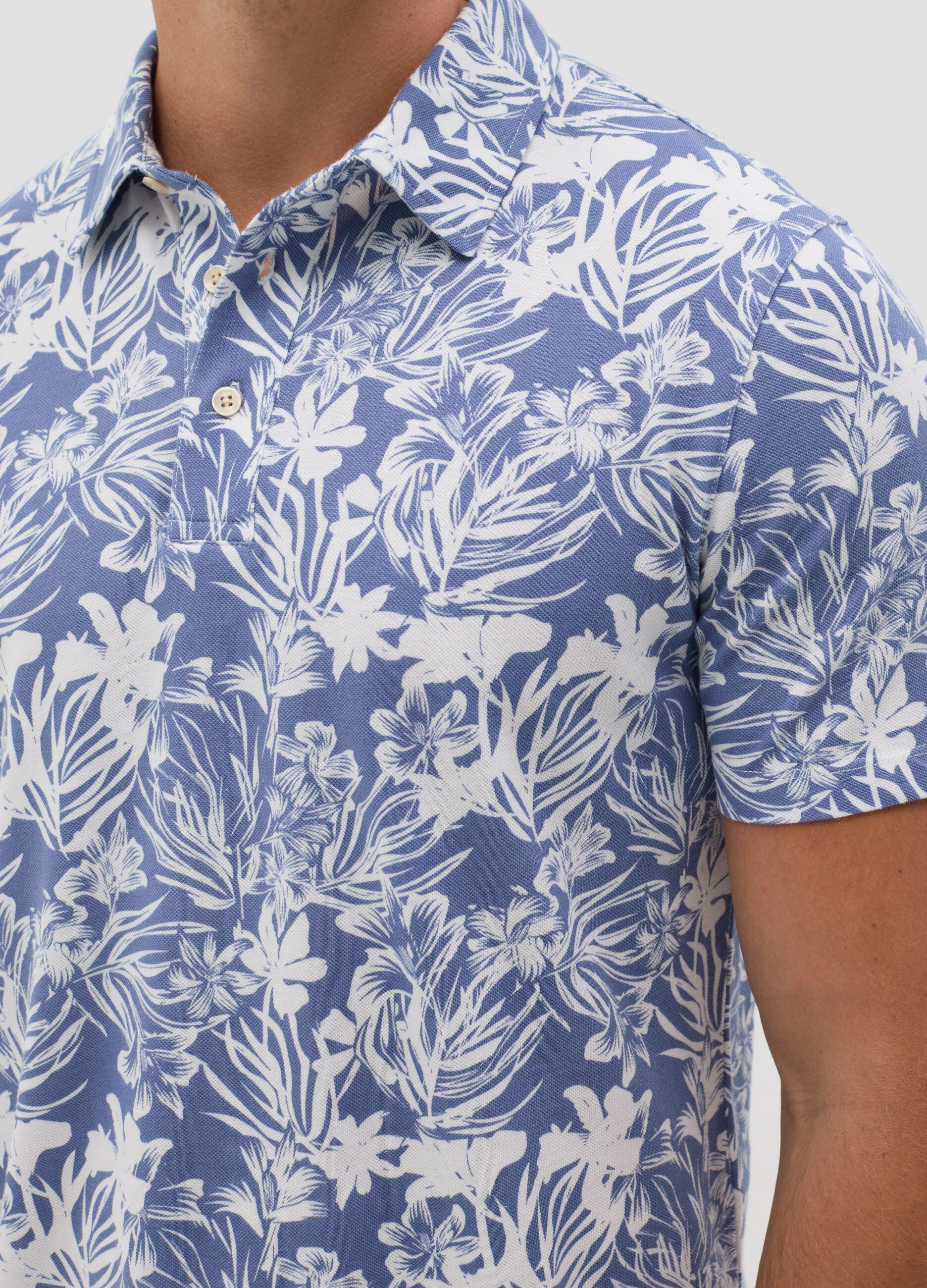 BST blue polo shirt with short sleeves and floral print
