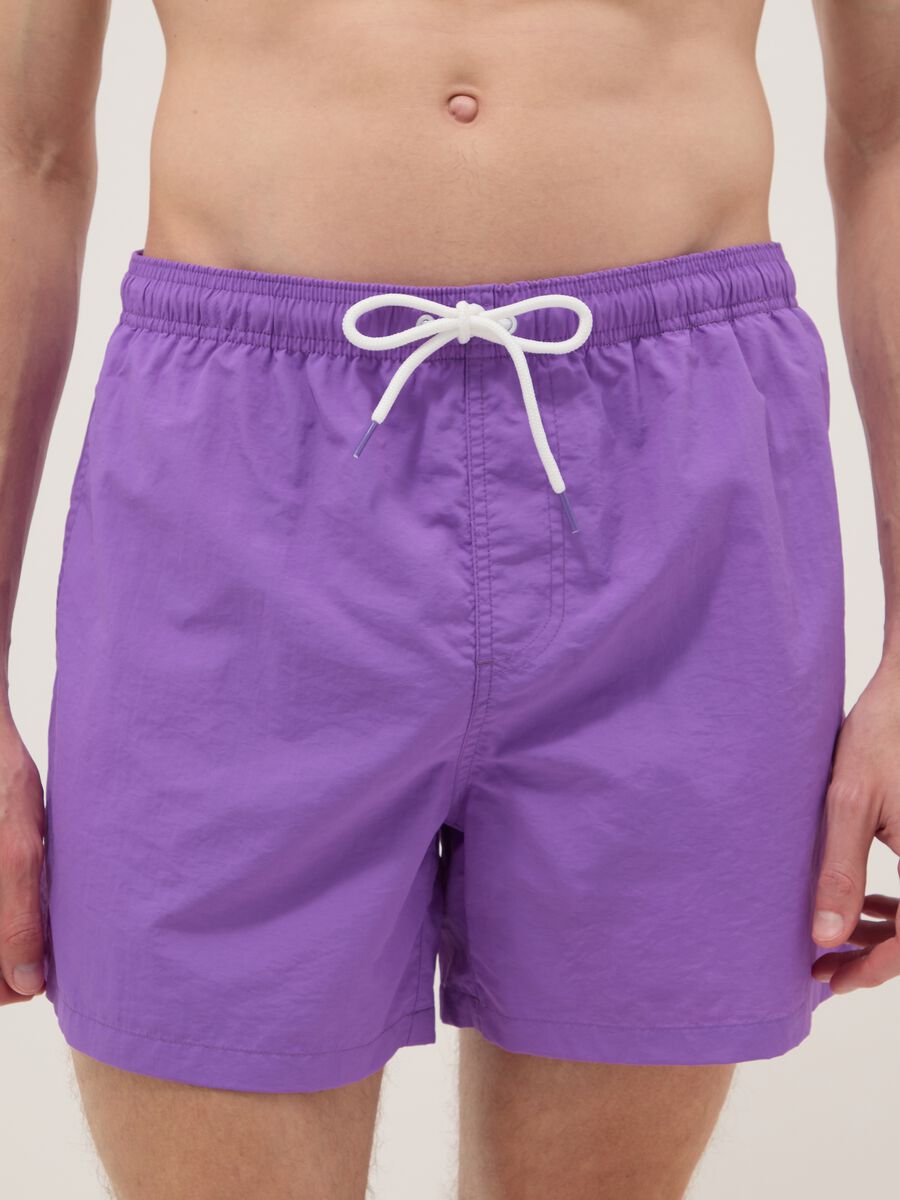 Purple swim shorts with elasticated waistband_1