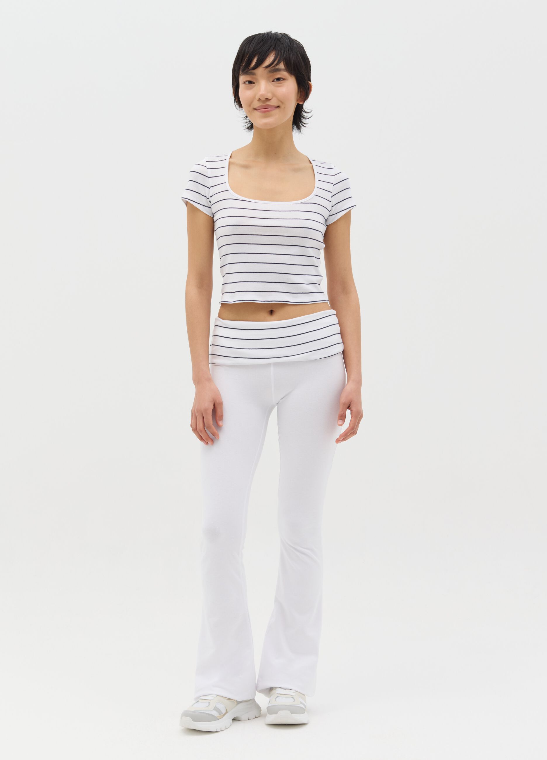 White flare-fit leggings with striped fold at the waist