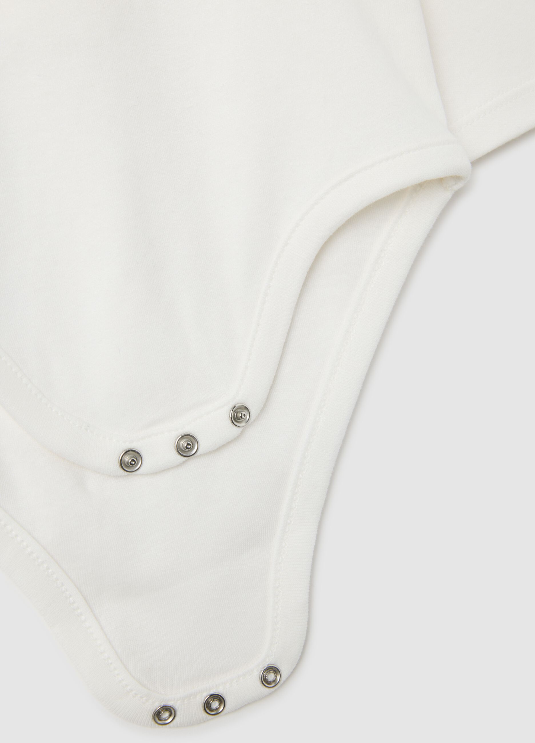 Unisex bodysuit for babies in pure white cotton with collar