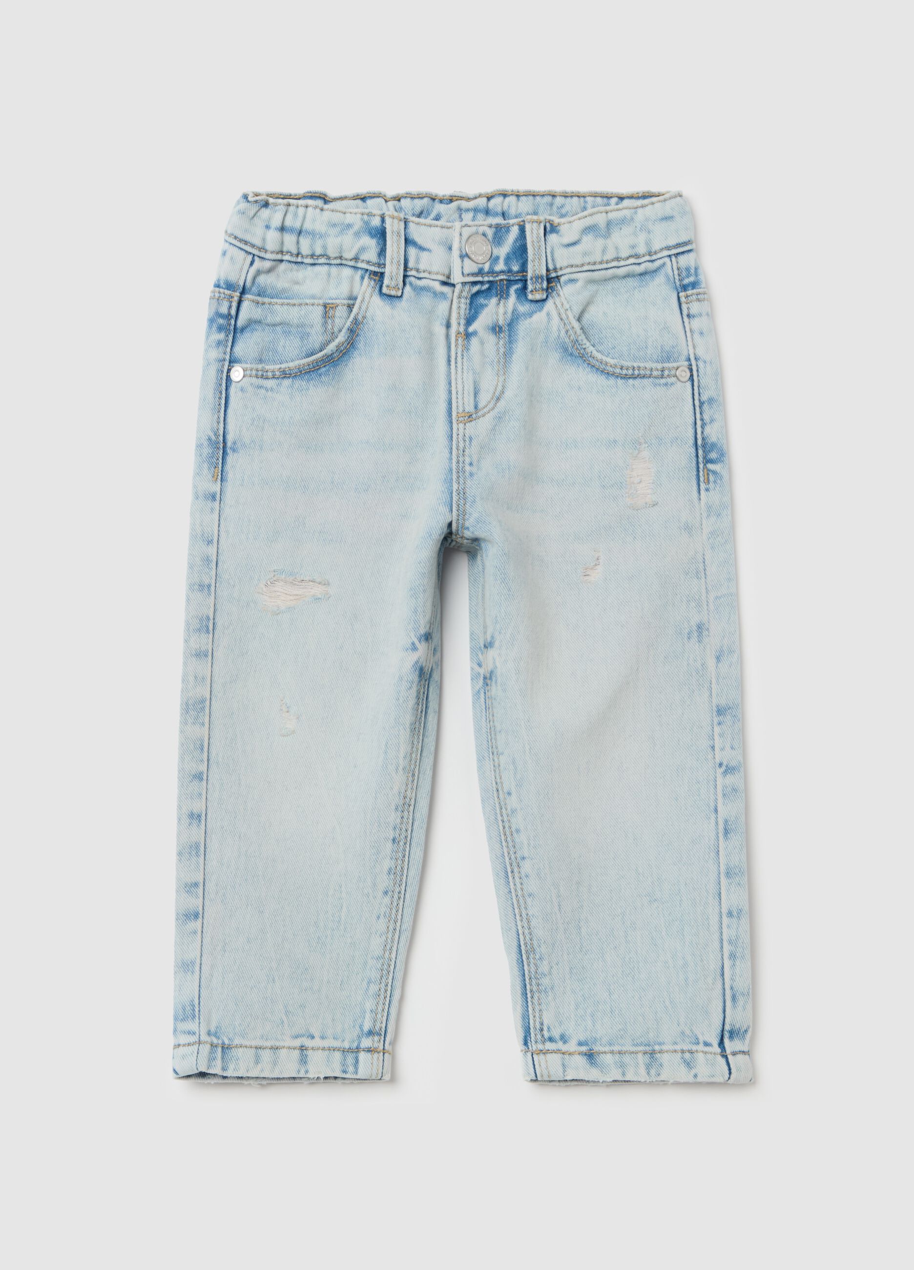 Jeans with five pockets and abrasions