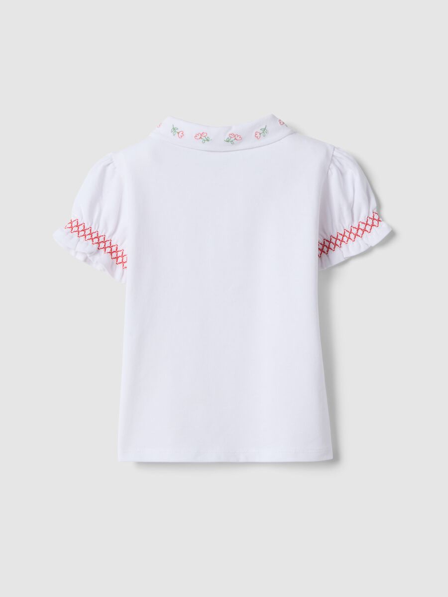 Polo in cotone elasticizzato bianca da bimba regular fit con ricami_1