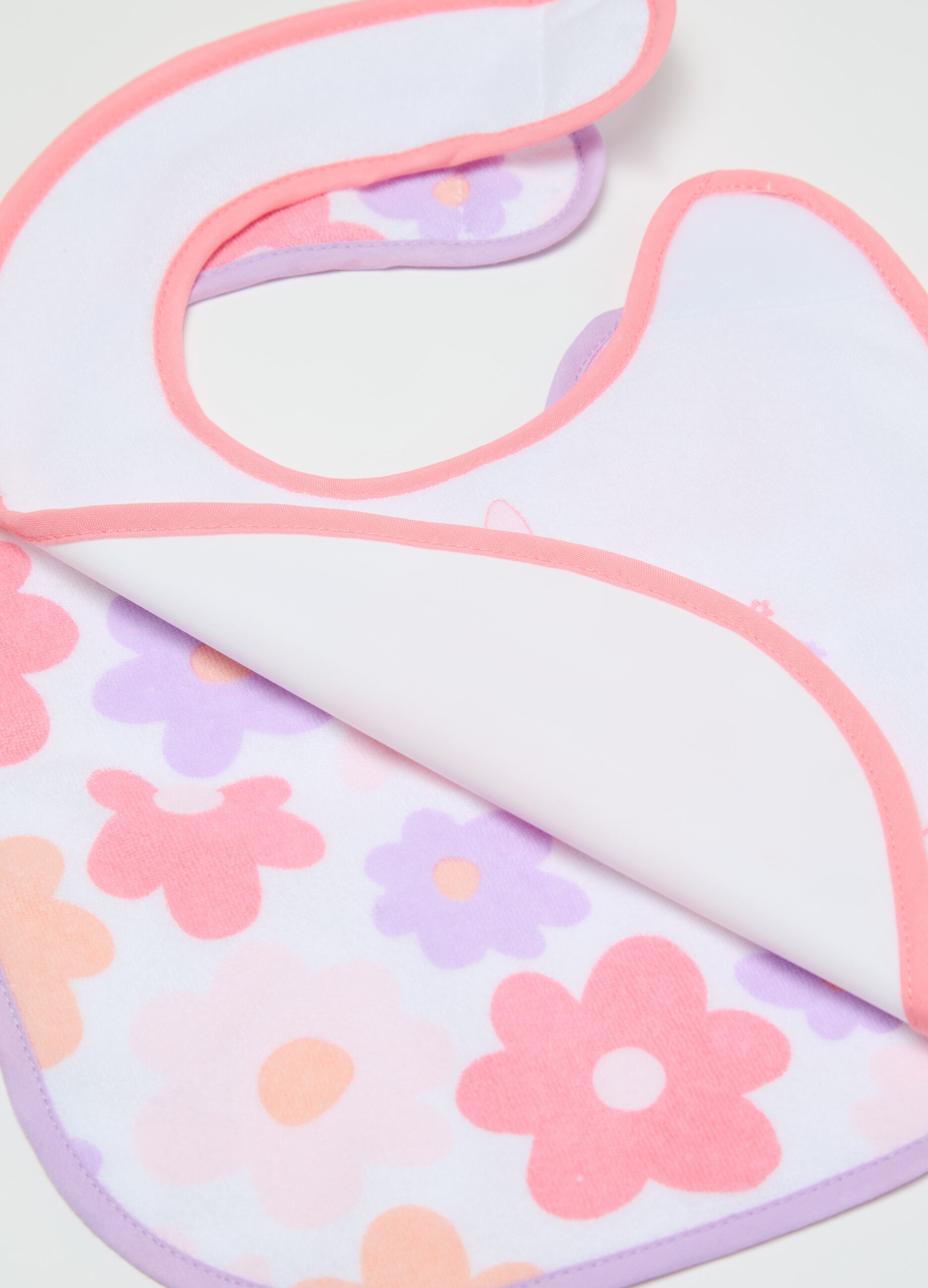 Two-pack bibs with PEVA backing and flowers print
