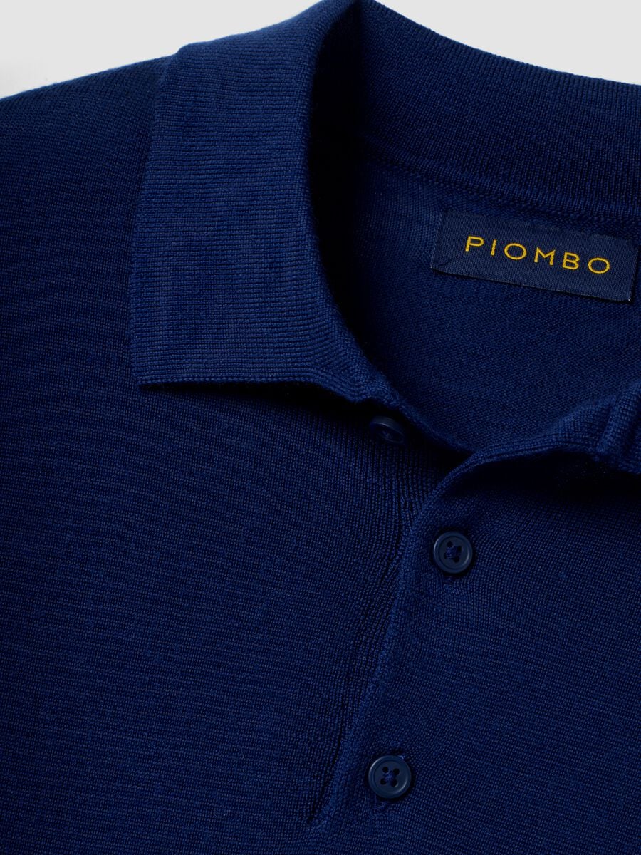 Maglia polo blu in pura lana merino con colletto polo_1