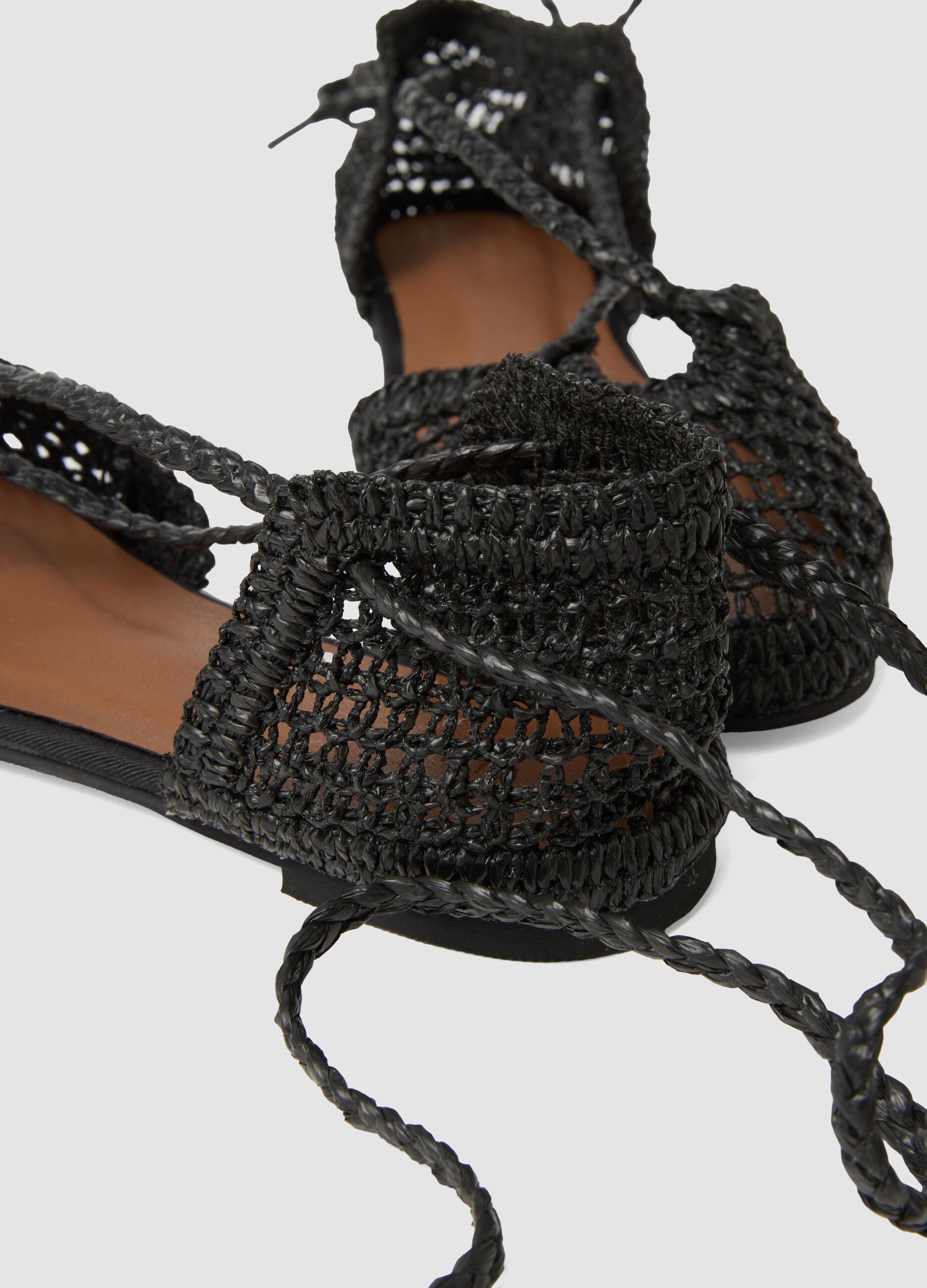 Black woven sandals