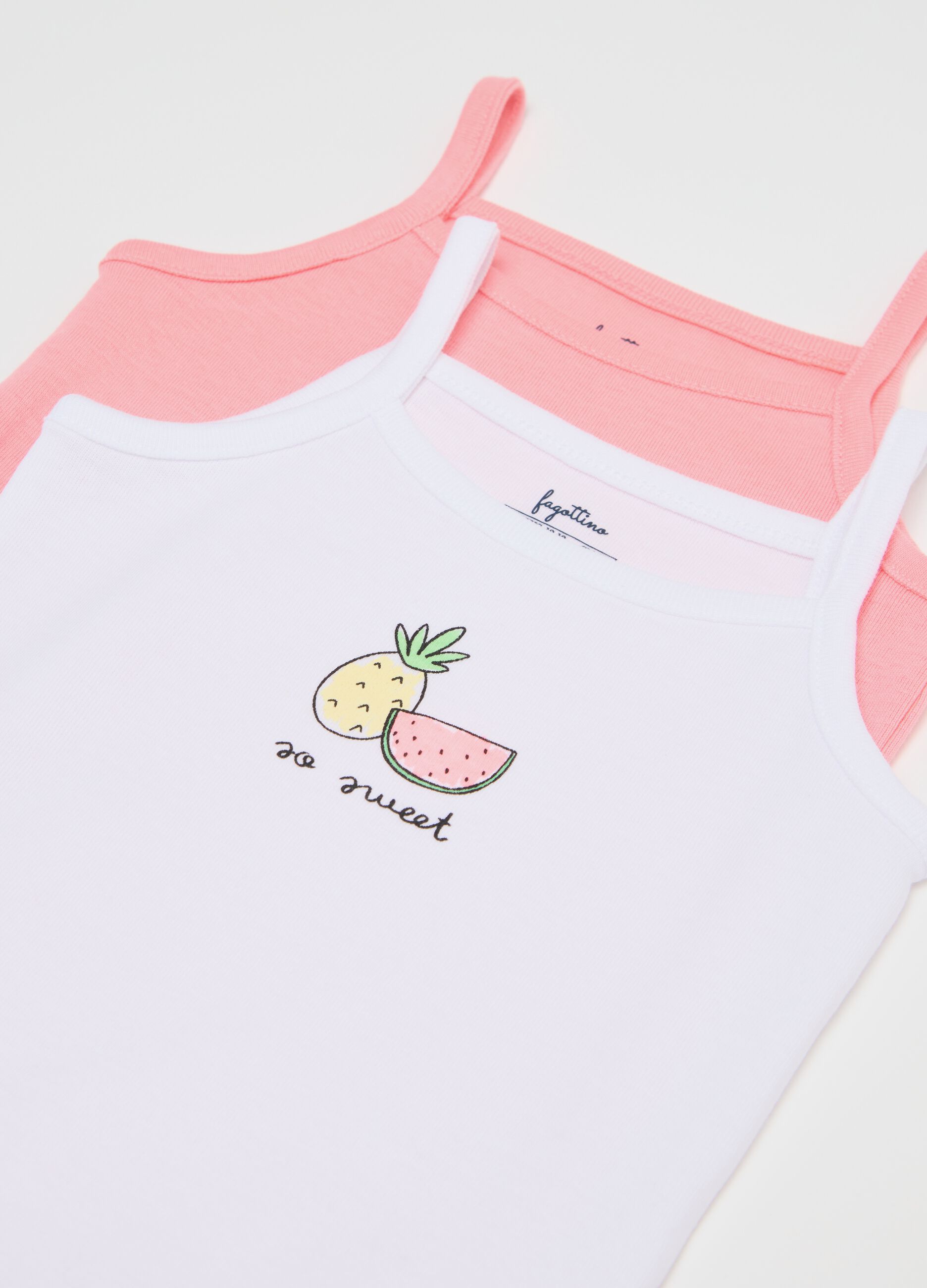 Three-pack sleeveless pink and white bodysuits in organic cotton with print