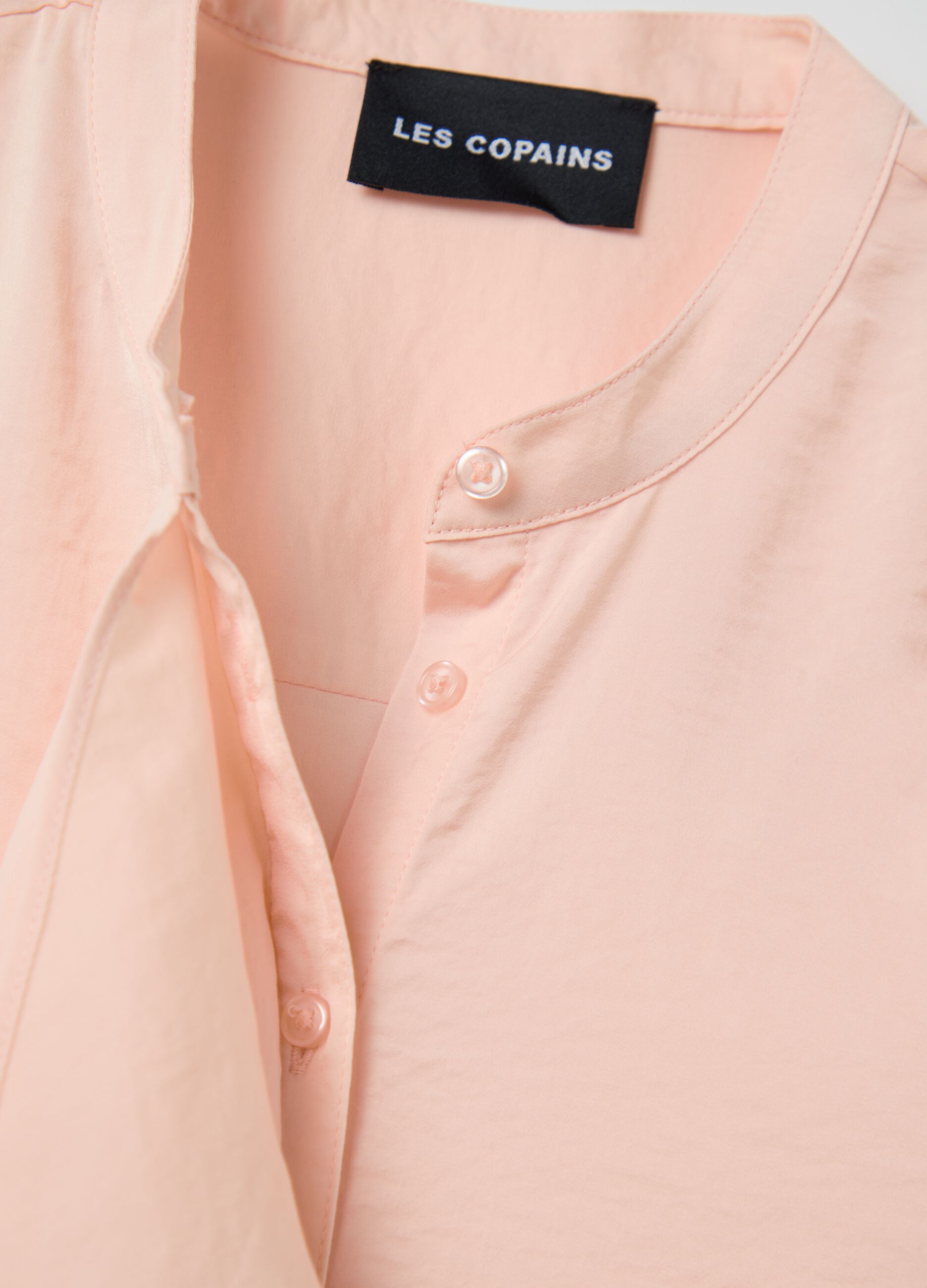 Pink sleeveless blouse with flounce