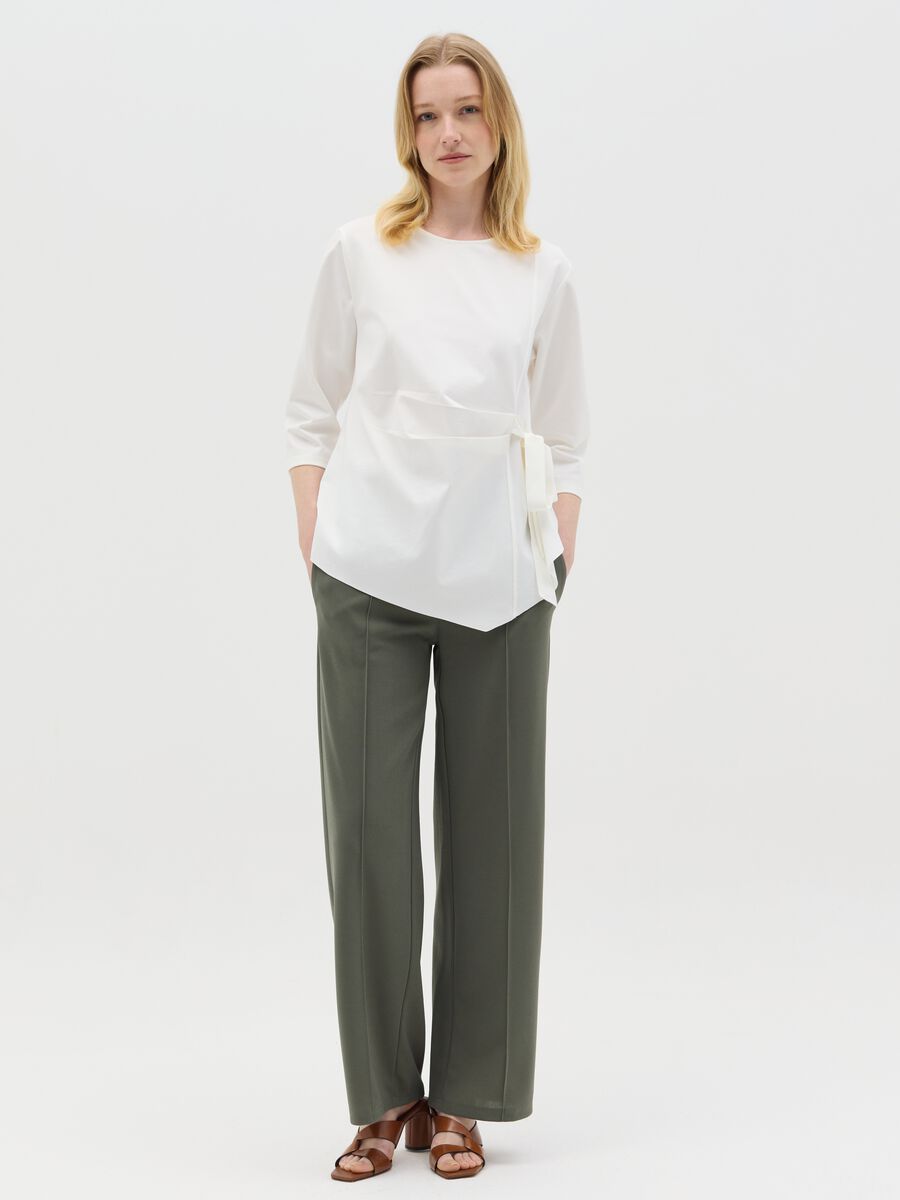 Green palazzo trousers with pockets_0