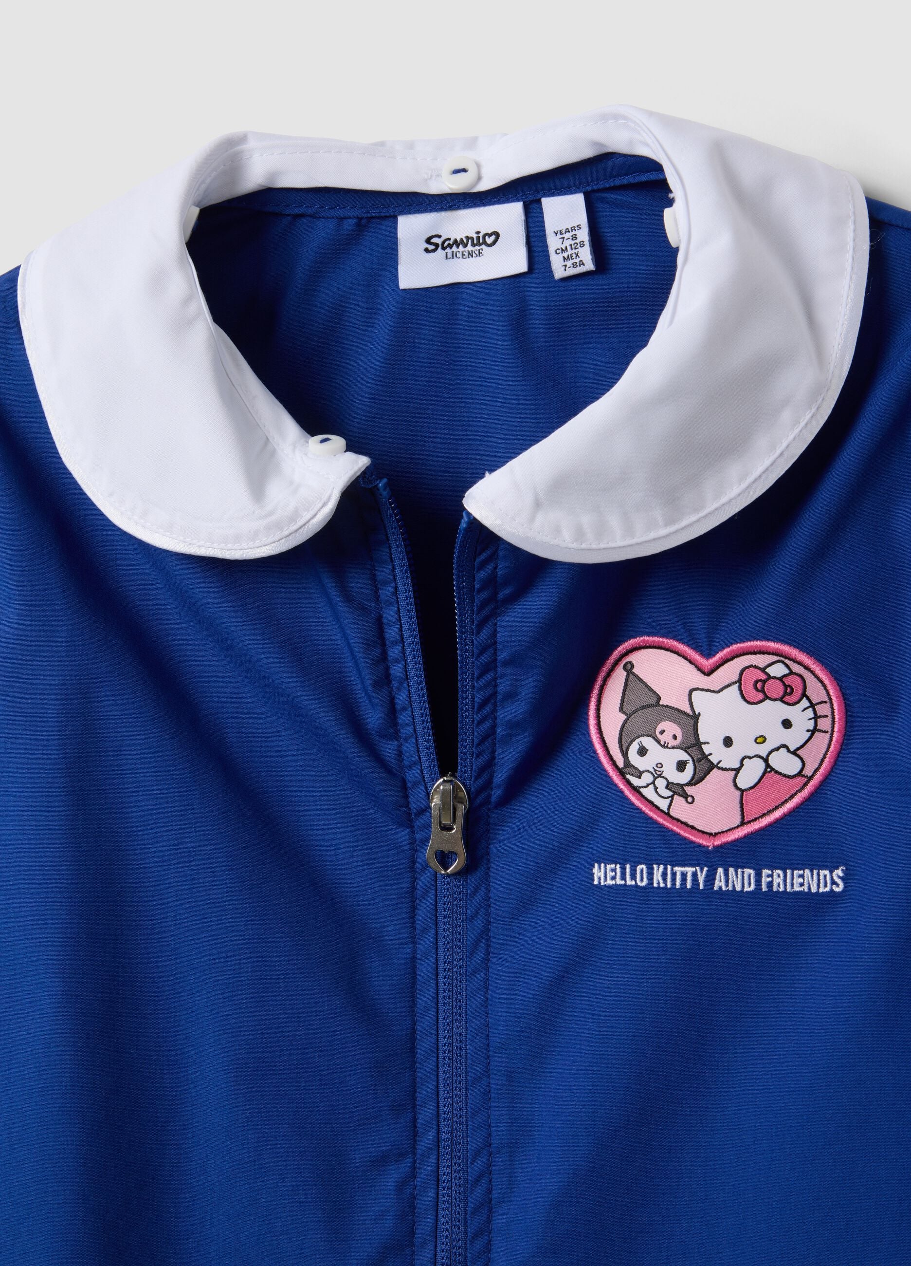 Blue girls&rsquo; school apron with Hello Kitty embroidery