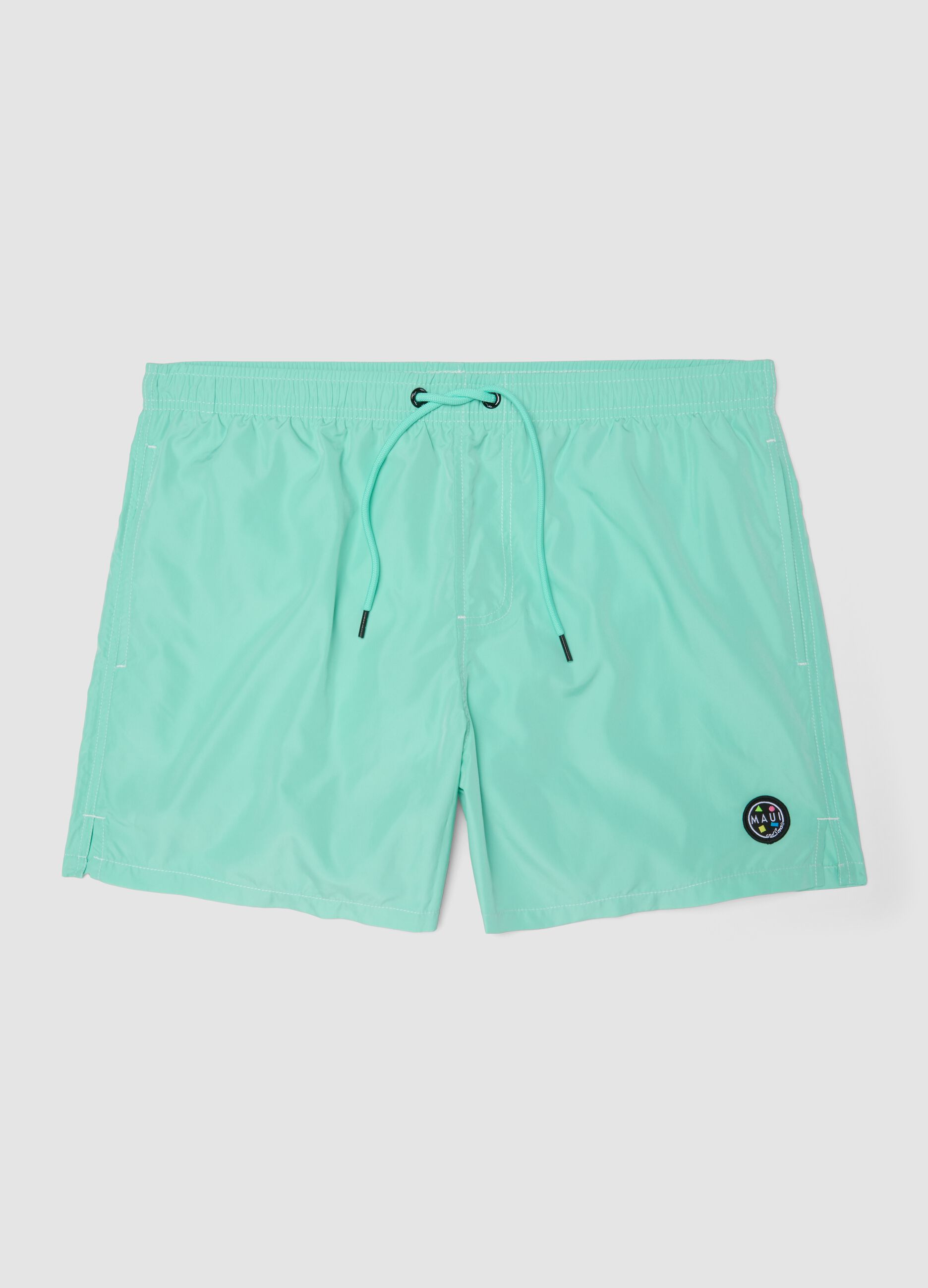 Light blue swim shorts with drawstring waist