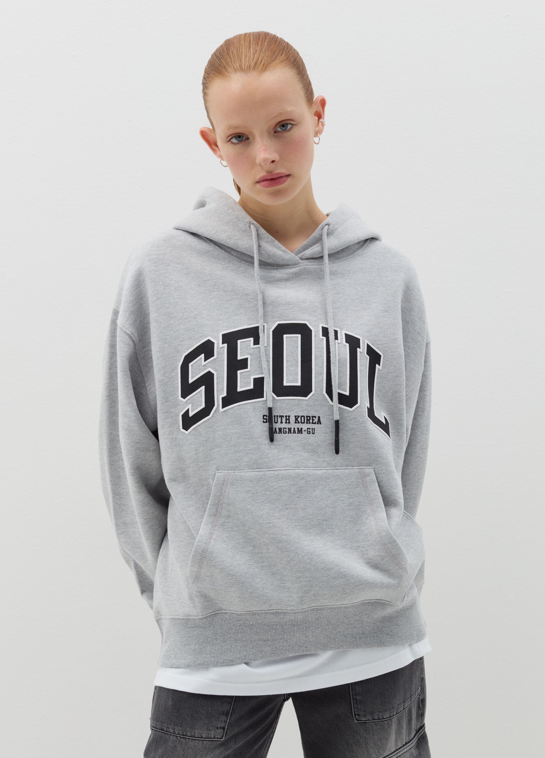 Oversized sweatshirt with hood and embroidery