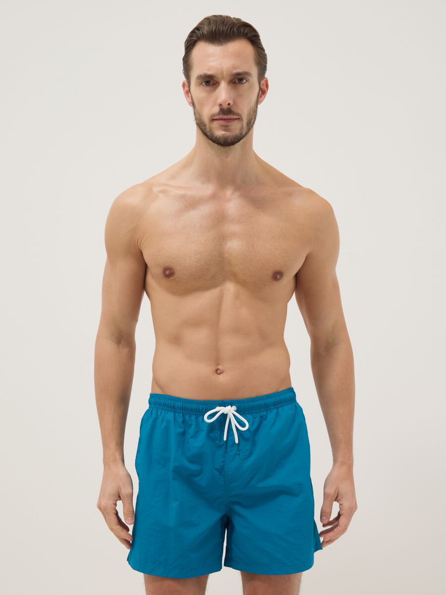 Blue swim shorts with elasticated waist_0